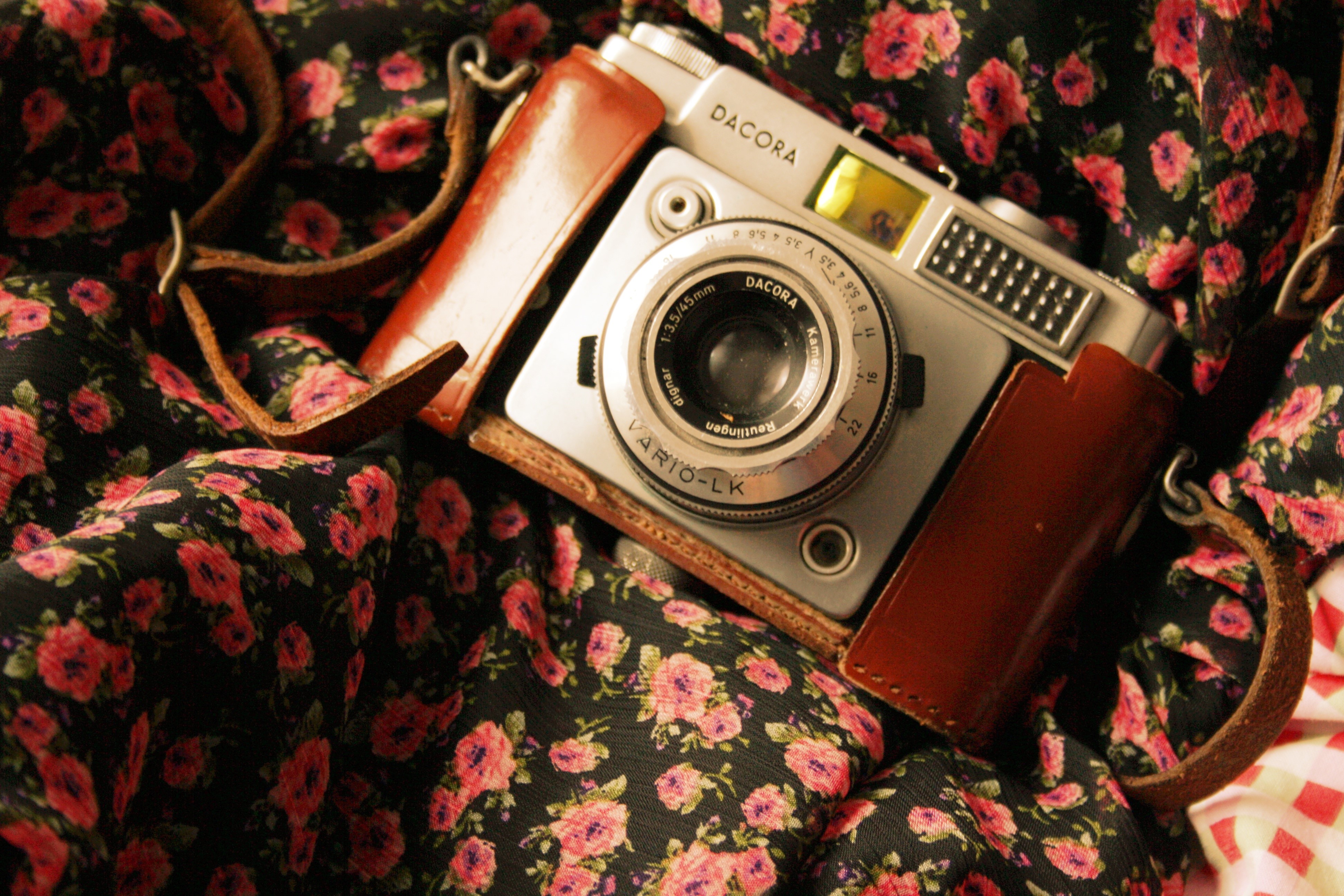 Dacora camera on floral fabric HD Wallpaper