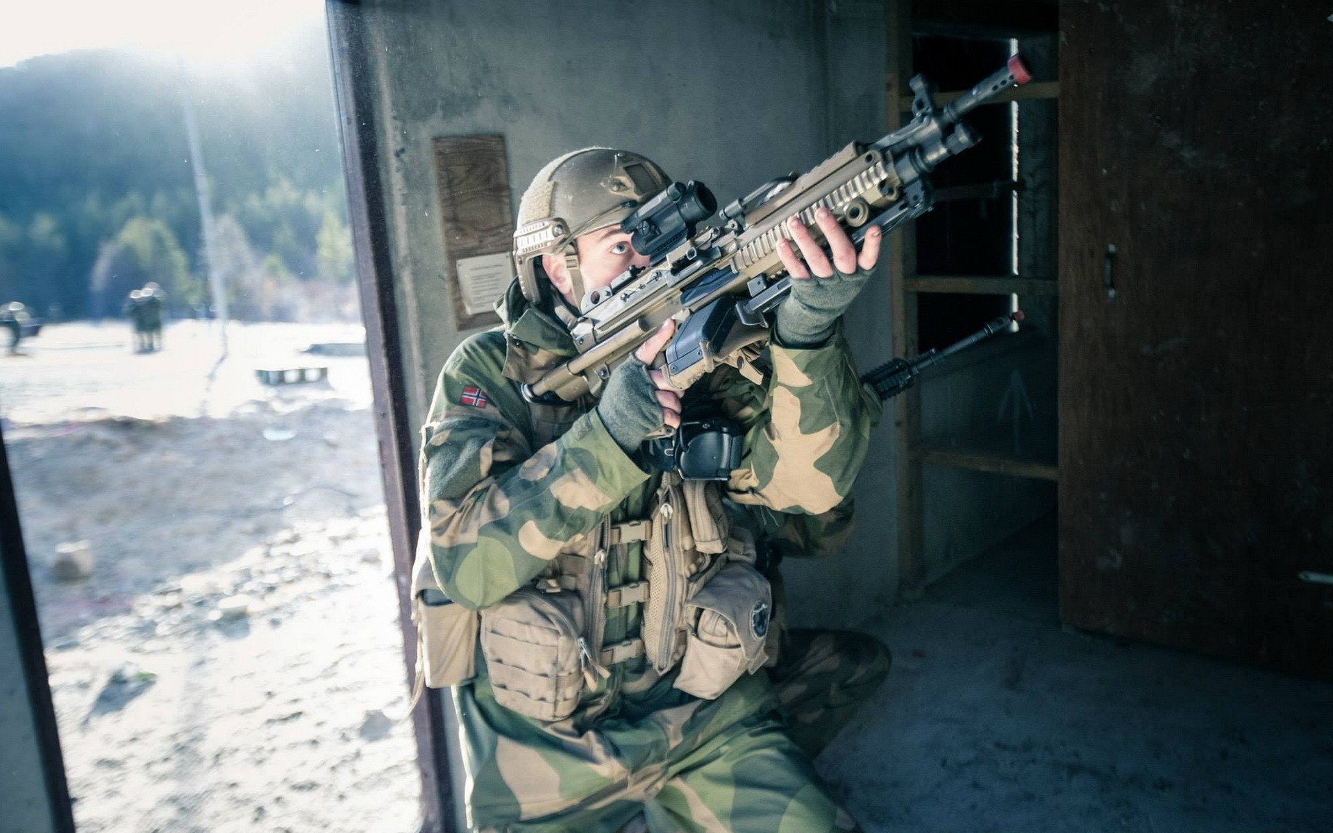 Soldier aiming an assault rifle in a building HD Wallpaper