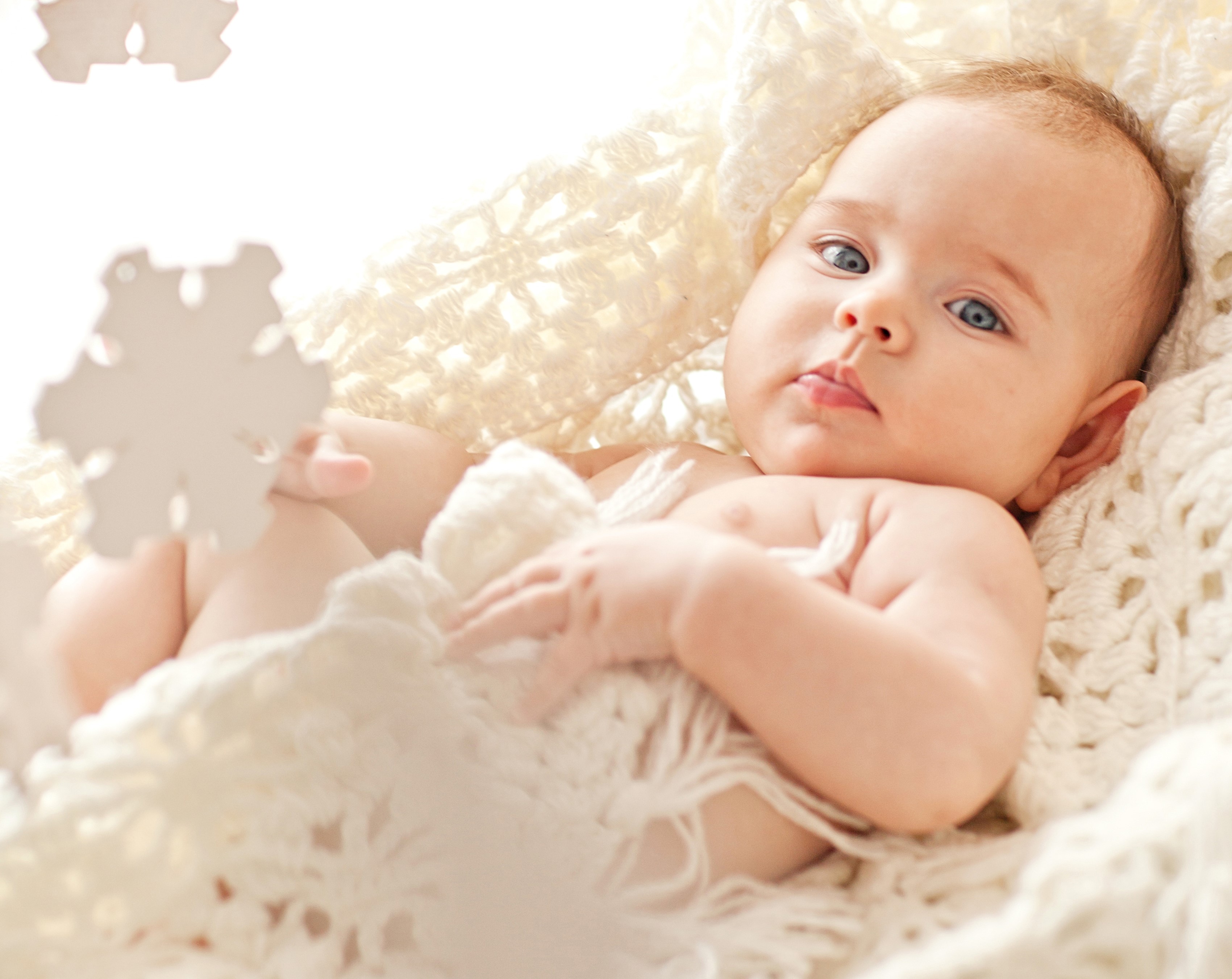 Baby with blue eyes and snowflakes HD Wallpaper