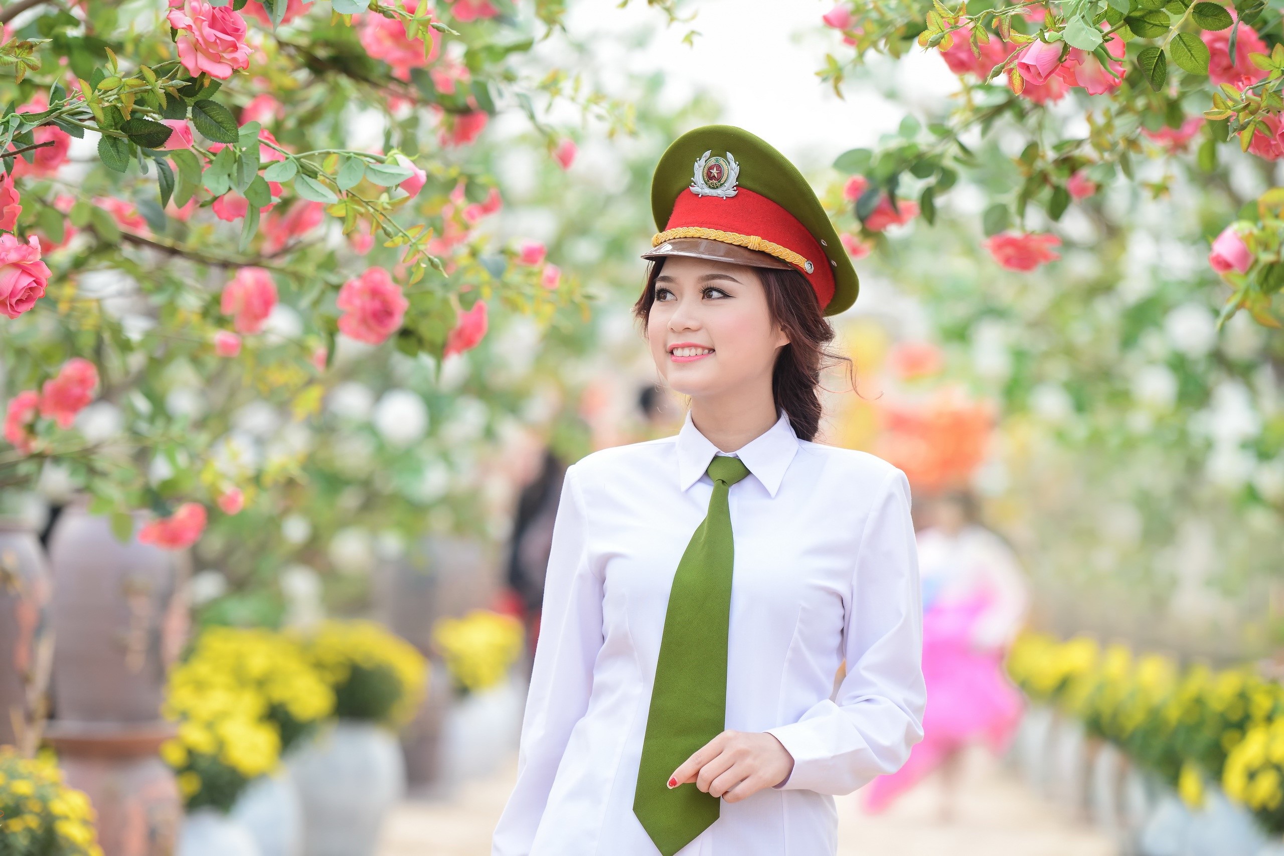 Young Woman in Uniform Among Flowering Trees HD Wallpaper