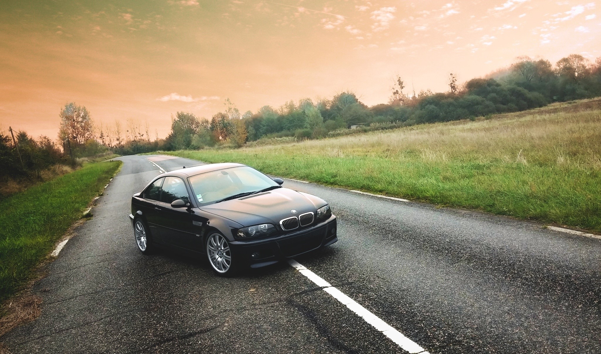 Black BMW E46 M3 on a country road HD Wallpaper