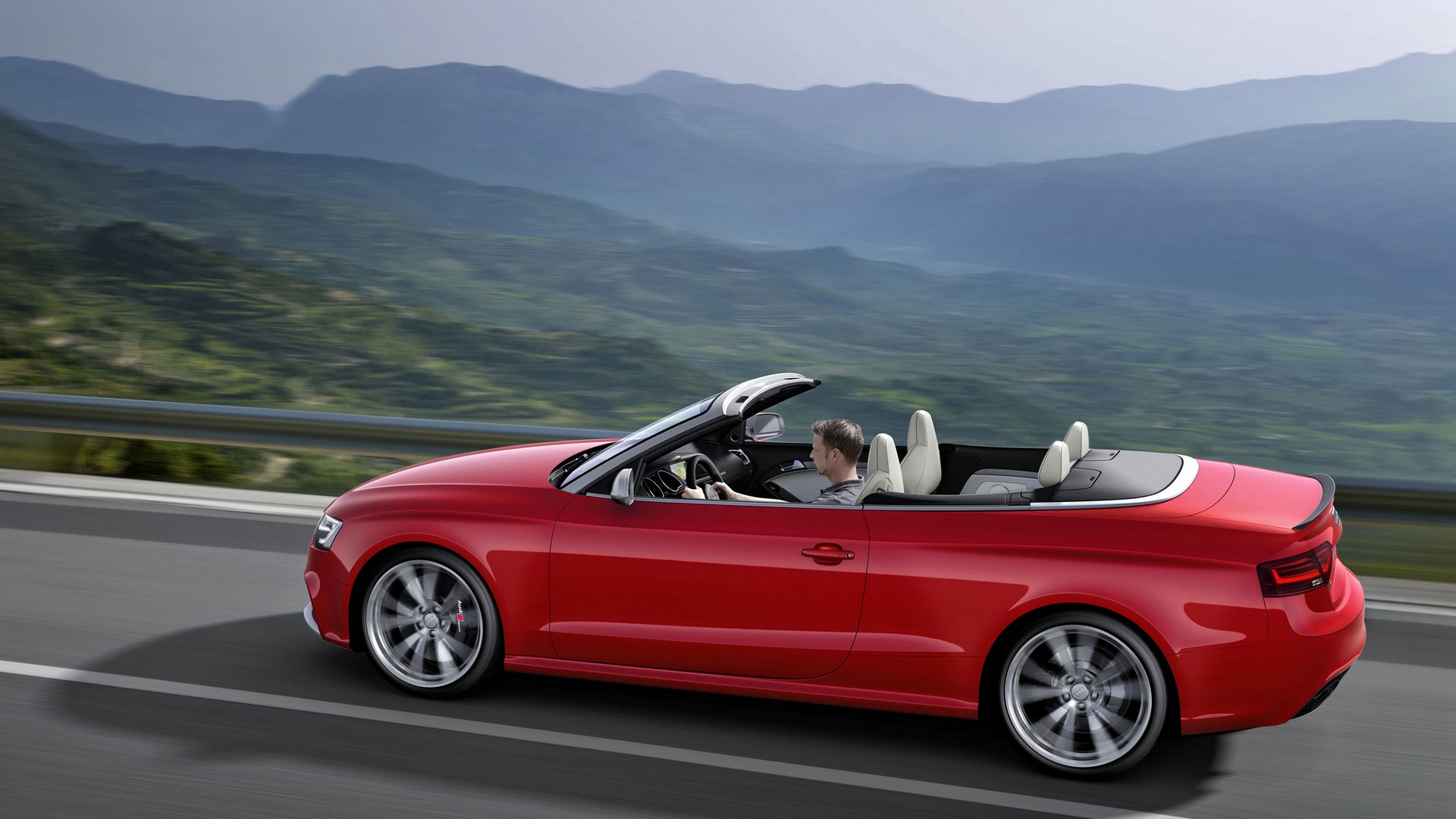 Red Audi RS 5 Cabriolet driving on a mountain road HD Wallpaper