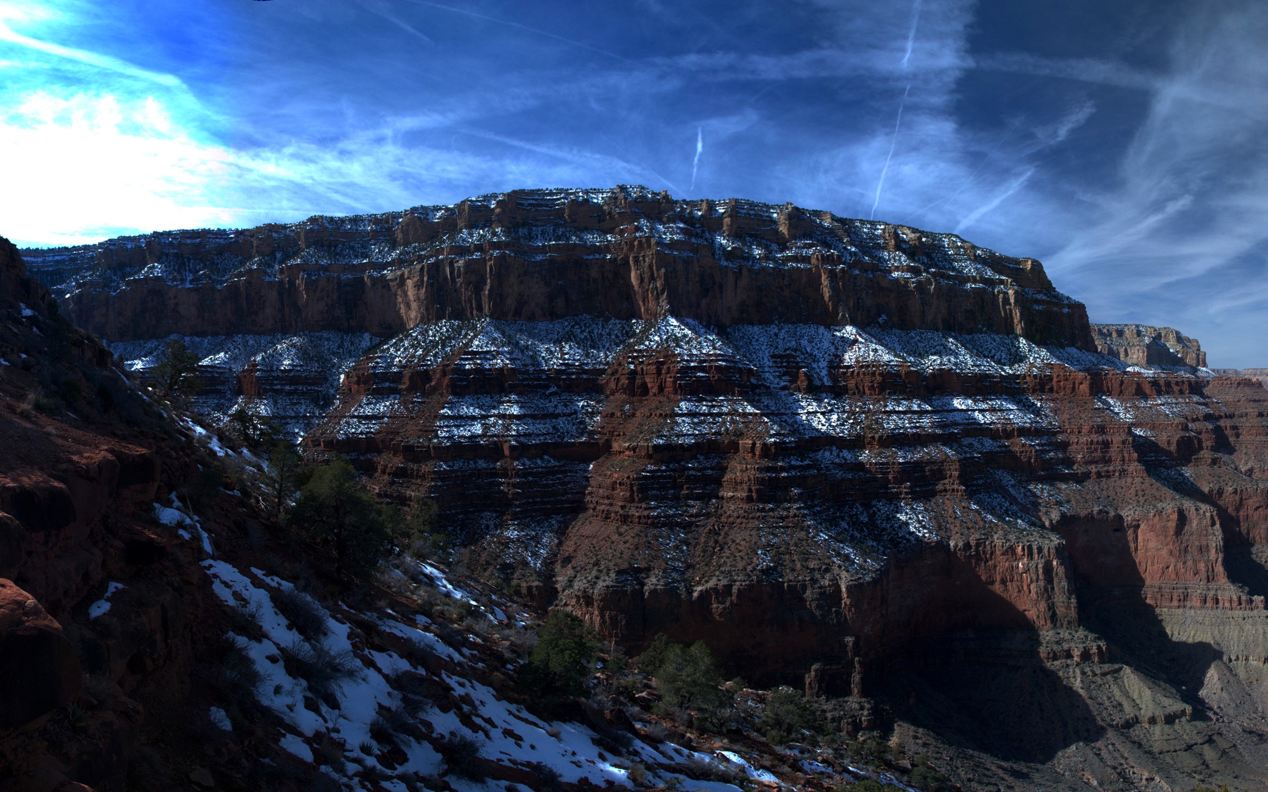 Grand Canyon with snow under a blue sky HD Wallpaper
