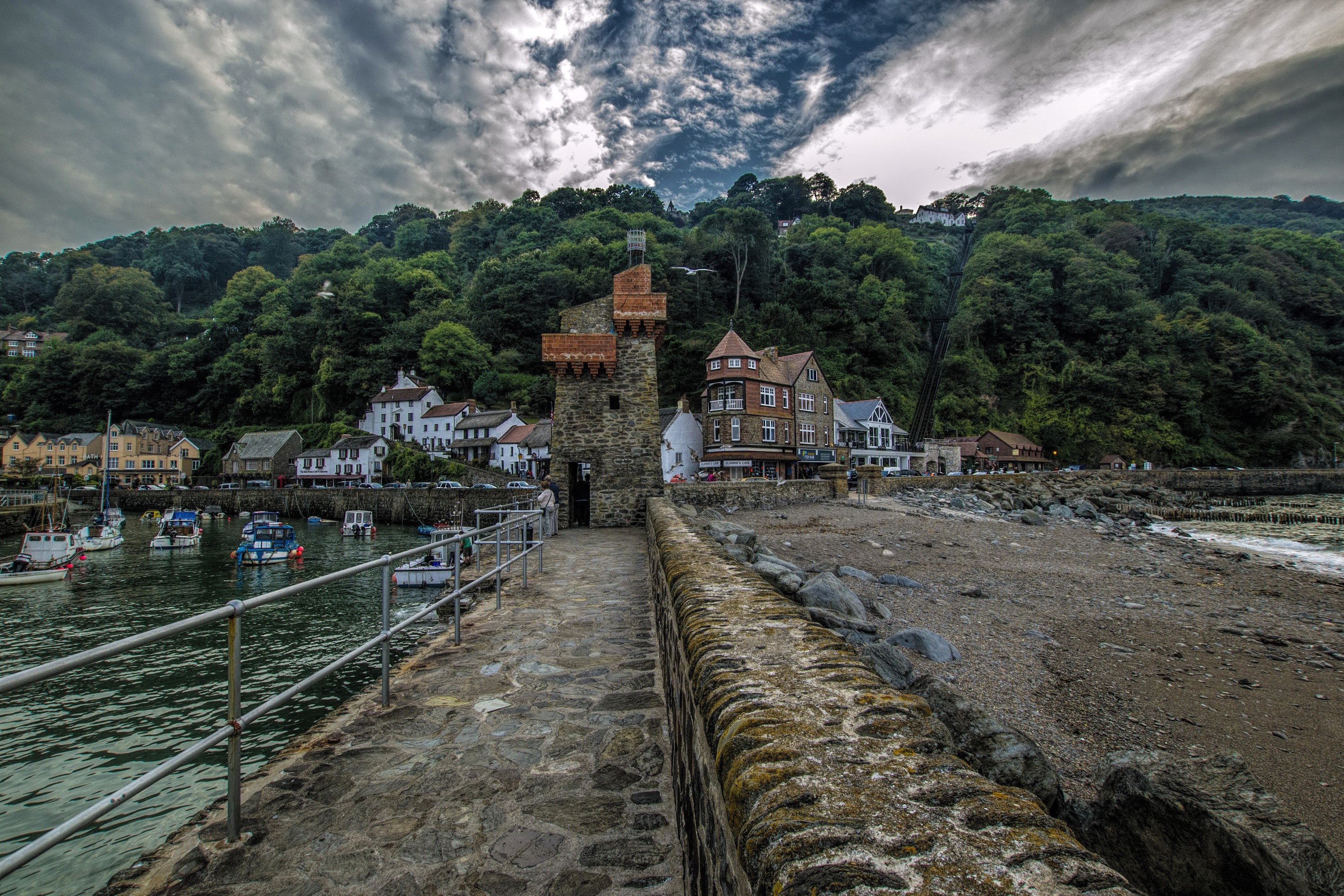 Lynmouth harbor with stone tower and houses HD Wallpaper