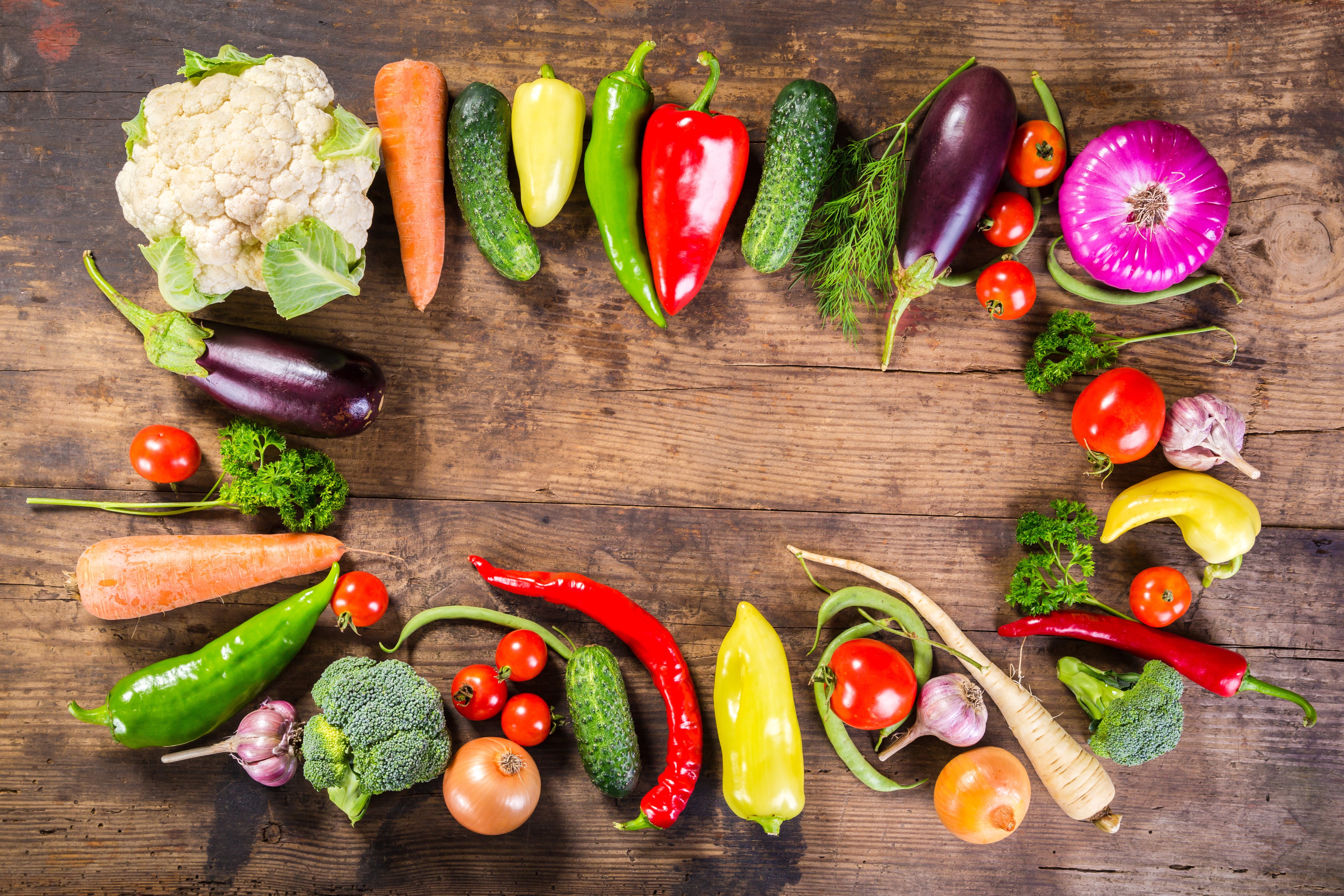 Assortment of fresh vegetables on a wooden table HD Wallpaper