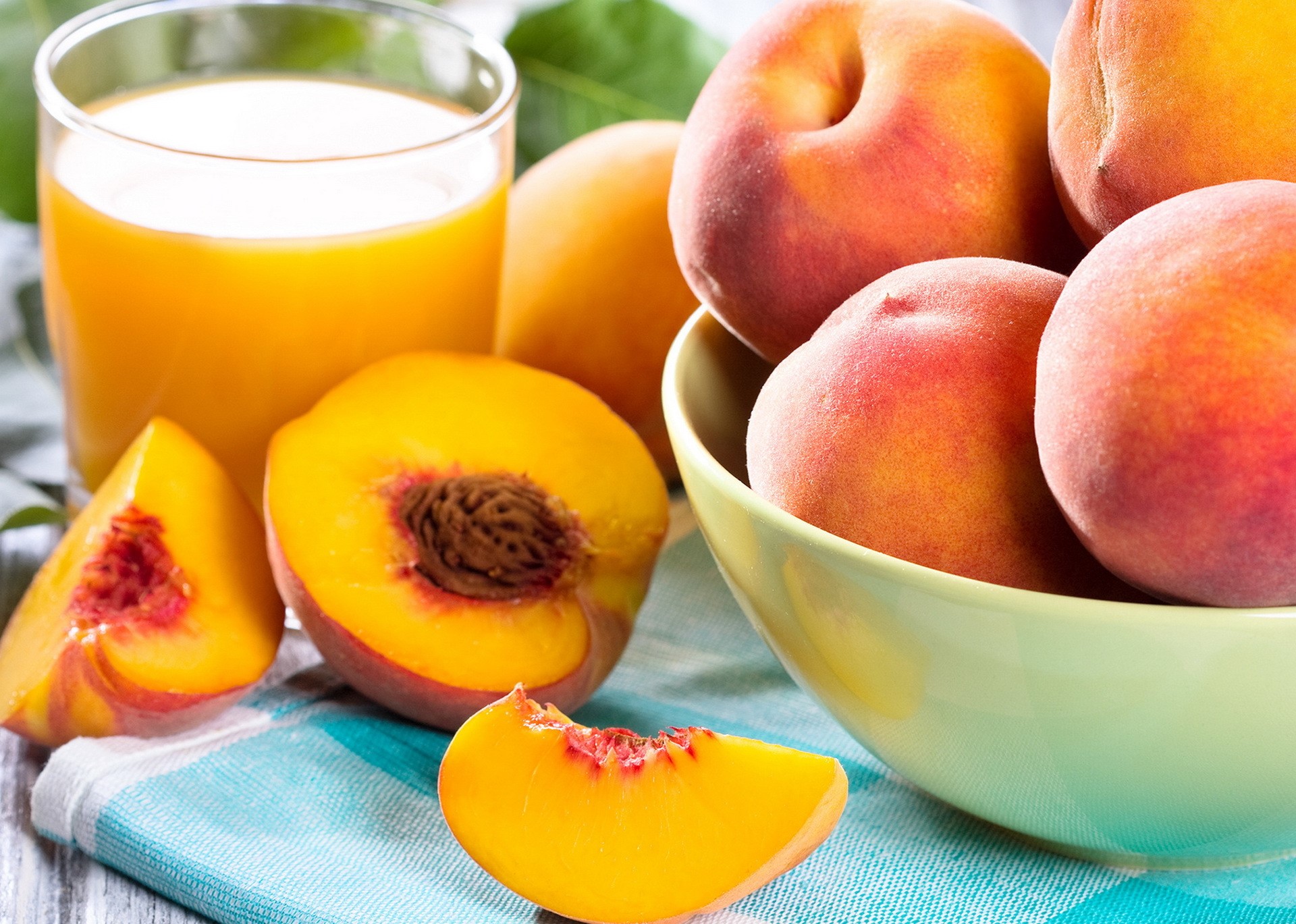 Peaches and Peach Juice on a Table HD Wallpaper