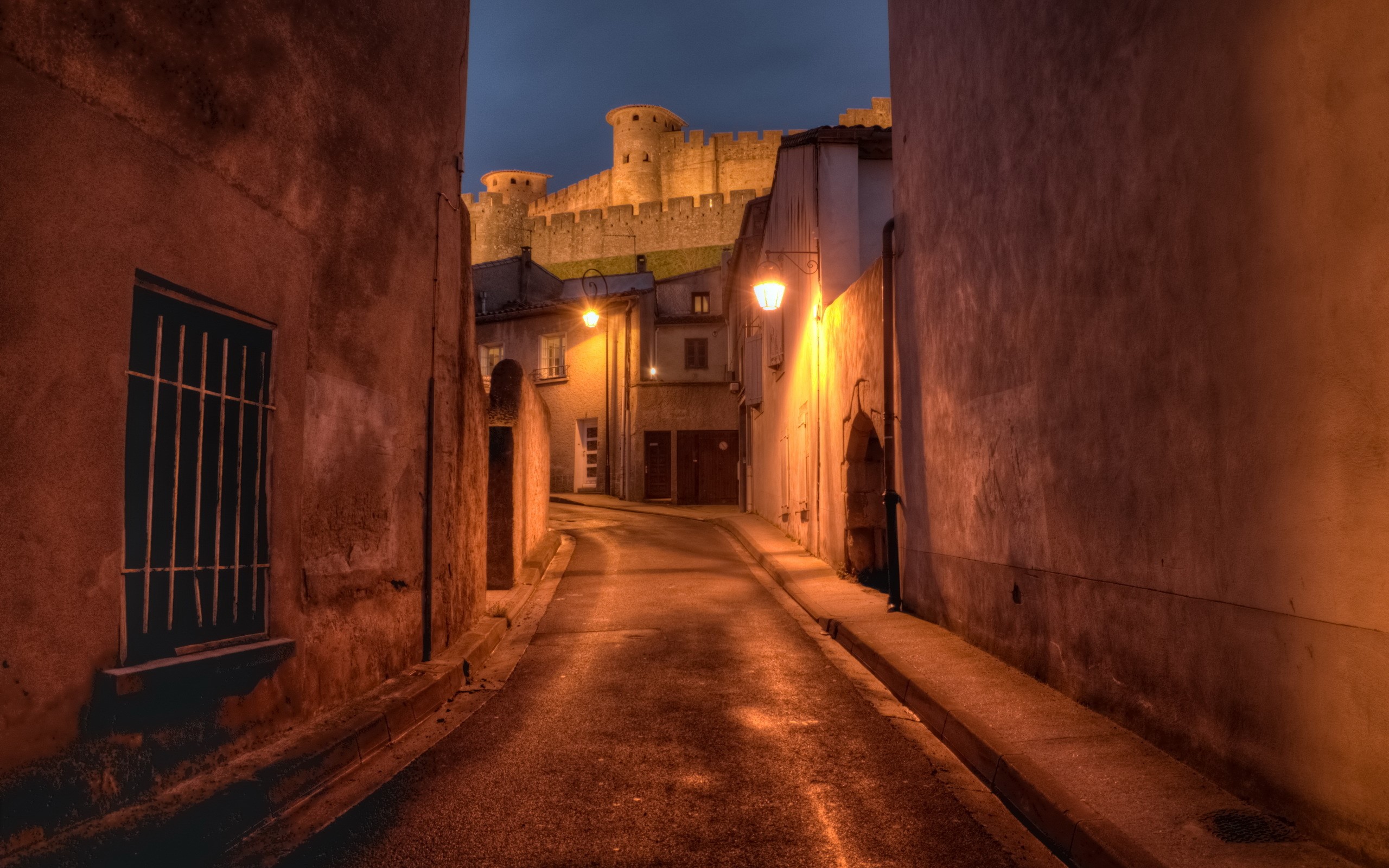 Street at night with castle in Carcassonne, France HD Wallpaper