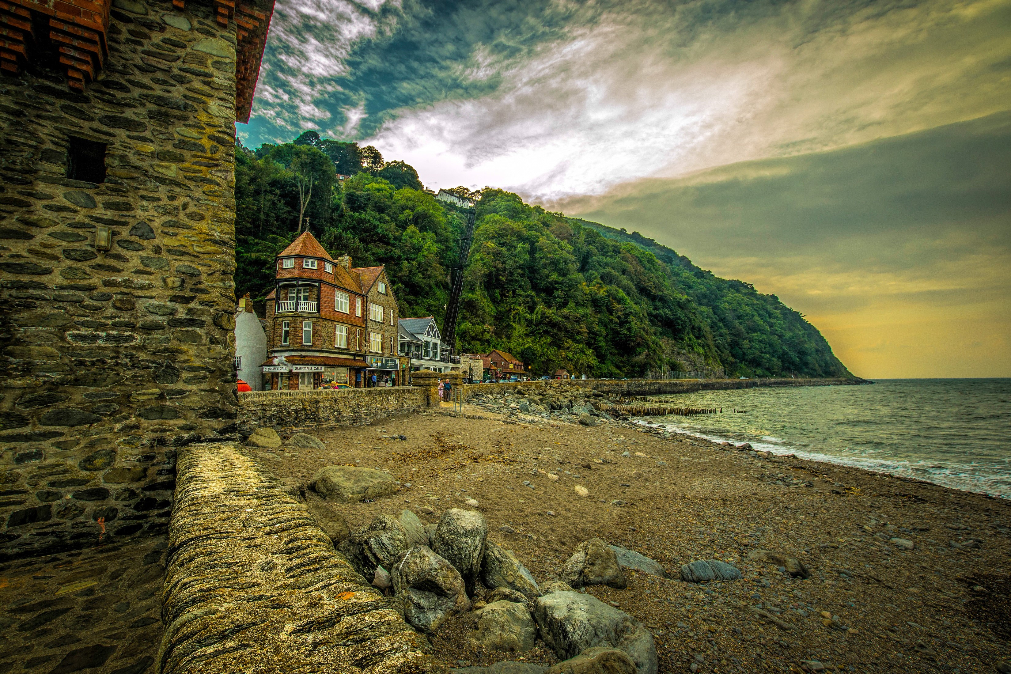 Lynmouth, England Coastline with Houses and Steep Hill HD Wallpaper