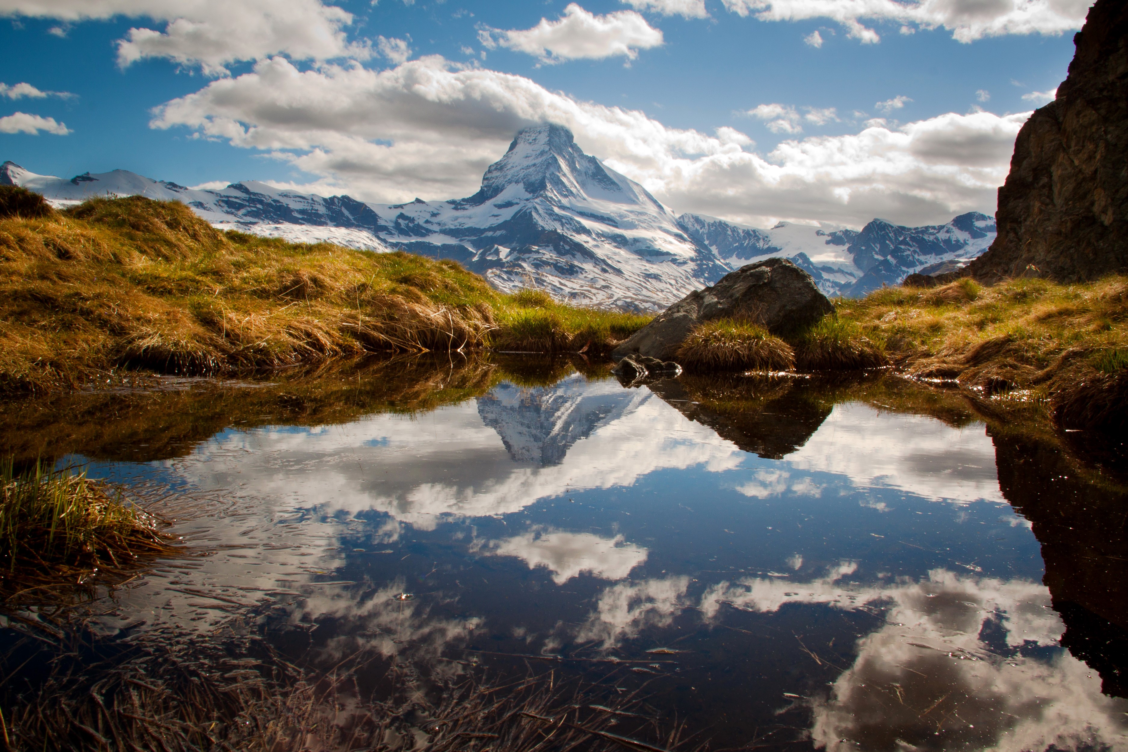 Matterhorn mountain reflected in a lake in Switzerland HD Wallpaper