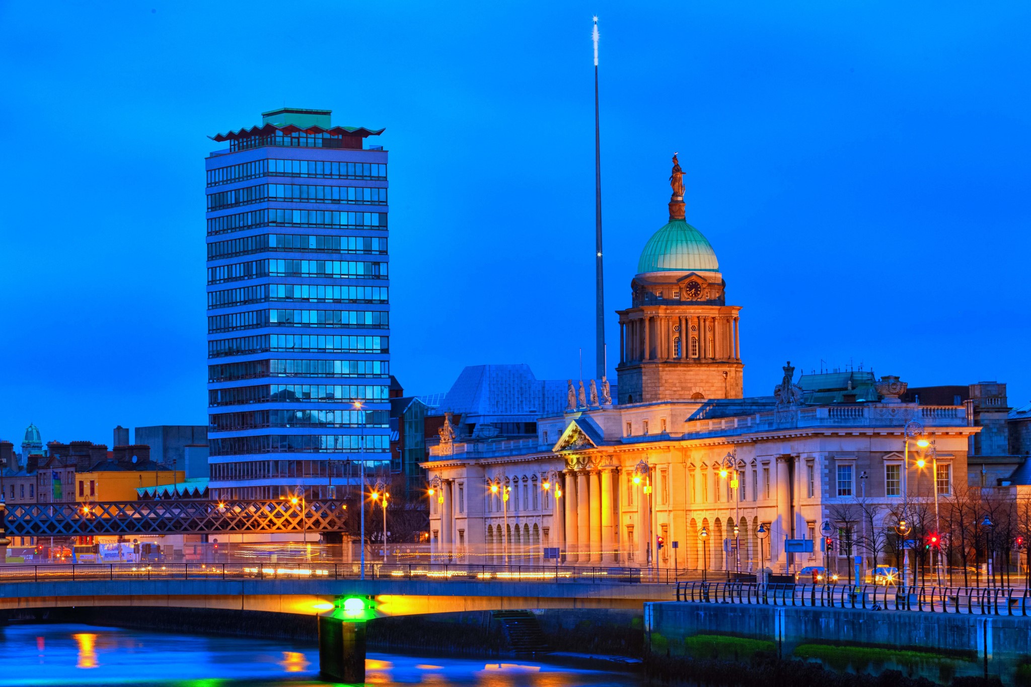 Dublin skyline at night with modern and historic buildings HD Wallpaper