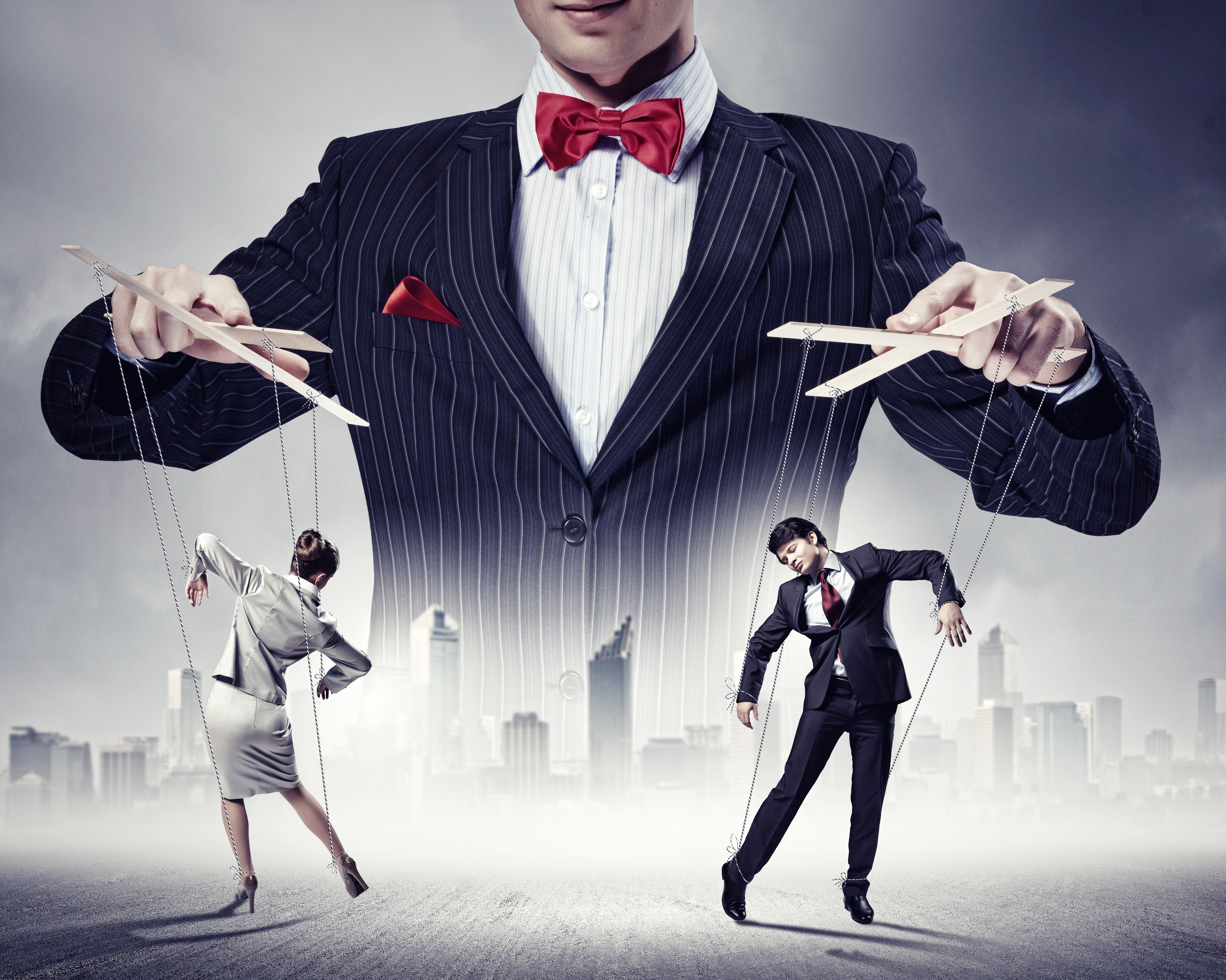 Man controlling puppets like dolls HD Wallpaper