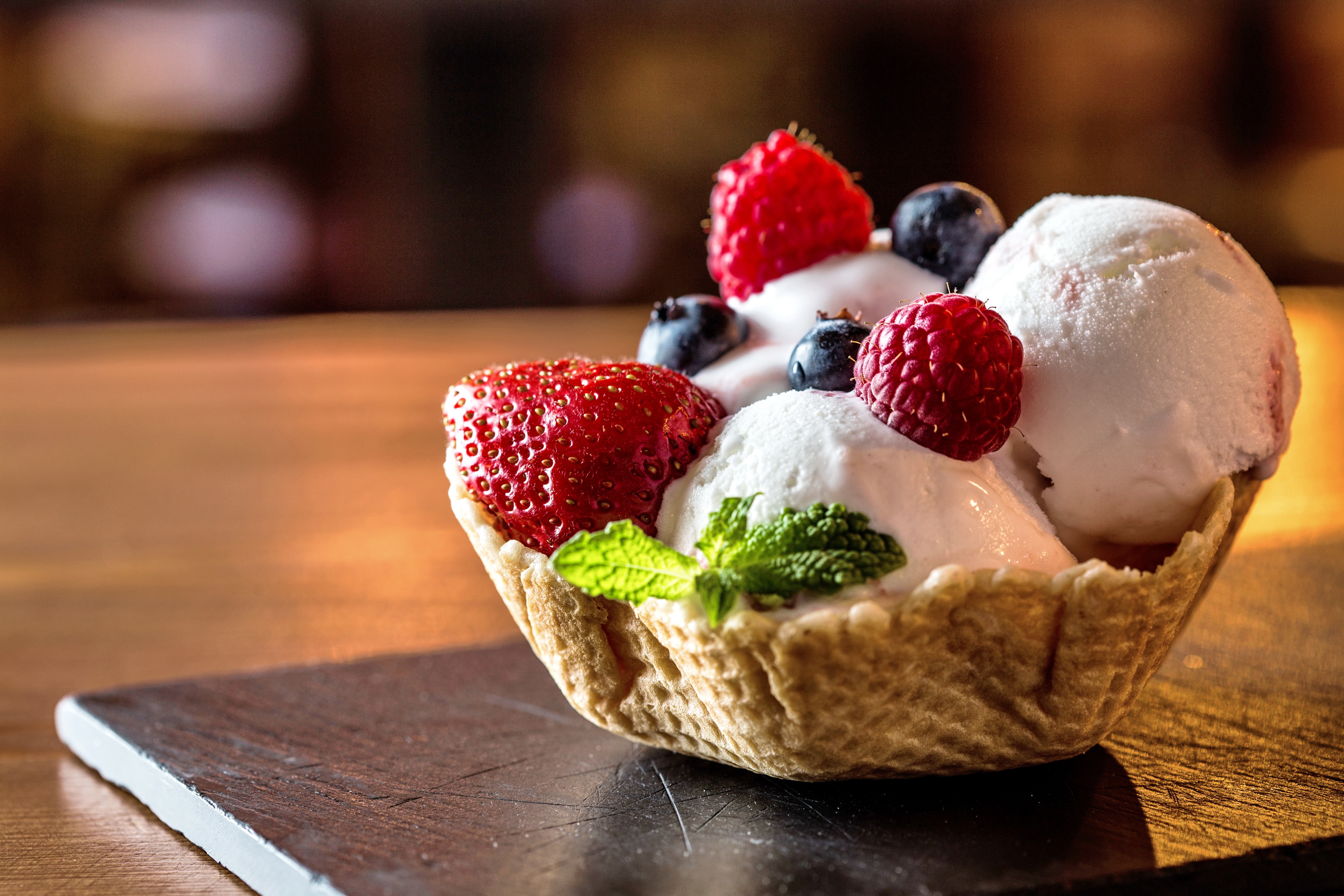Ice cream with strawberries and blueberries in a waffle bowl HD Wallpaper