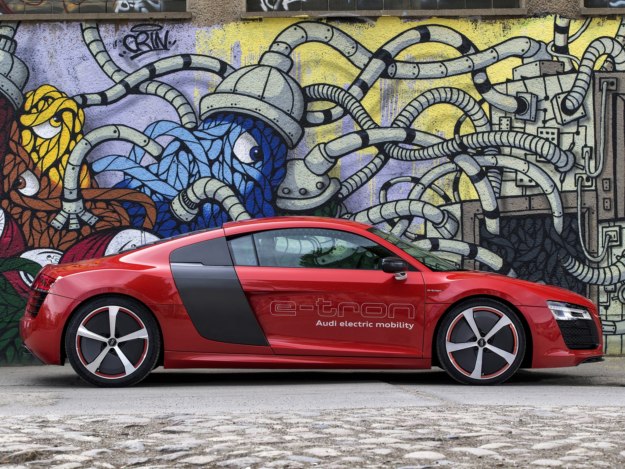 Red Audi R8 e-Tron parked in front of graffiti HD Wallpaper