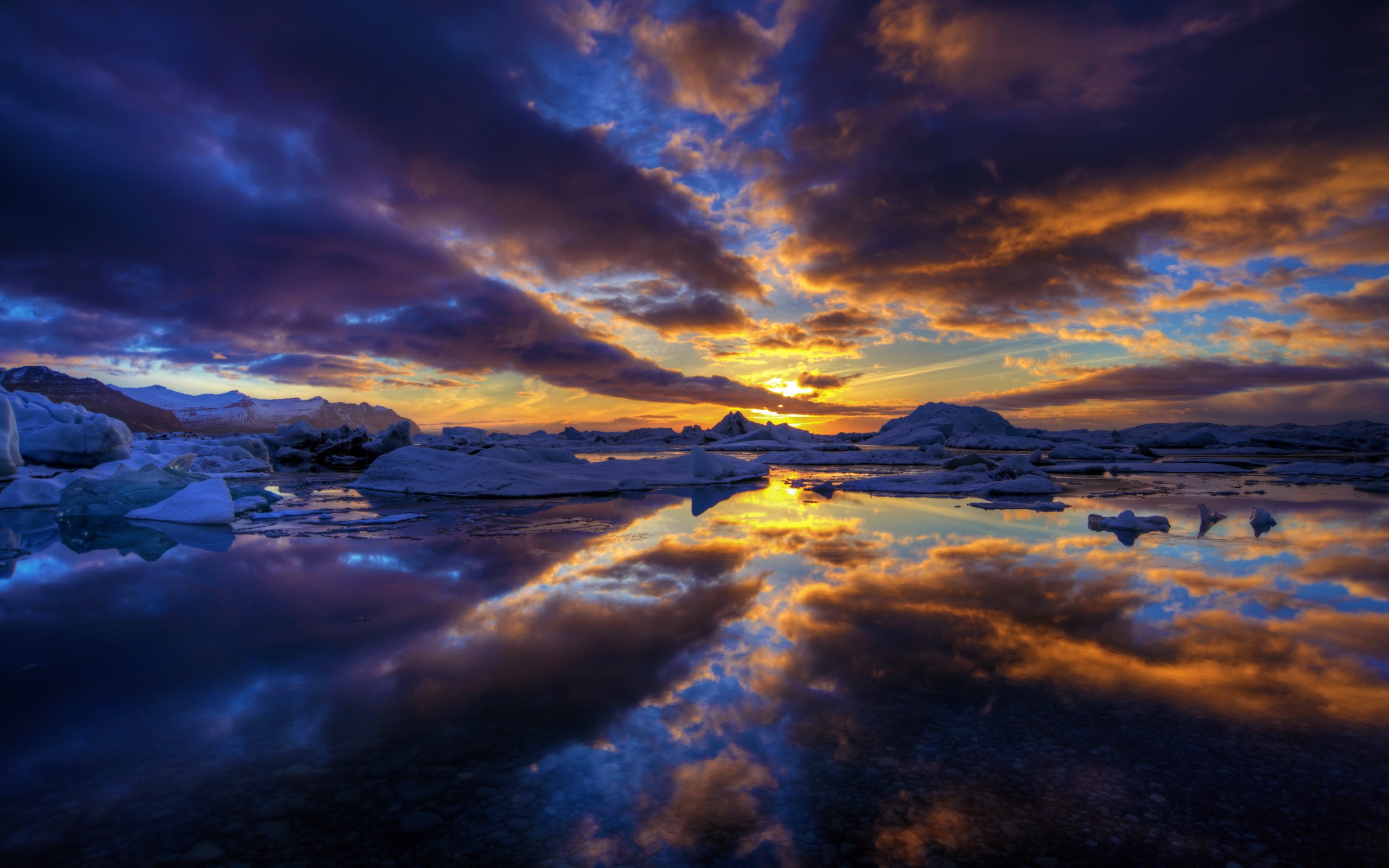 Icebergs floating in water during sunset HD Wallpaper
