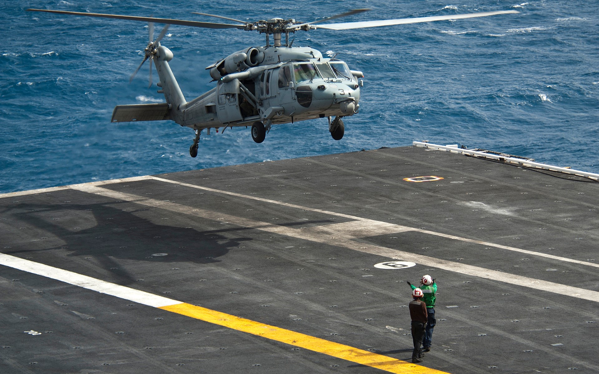 Sikorsky UH-60 Black Hawk helicopter landing on aircraft carrier HD Wallpaper