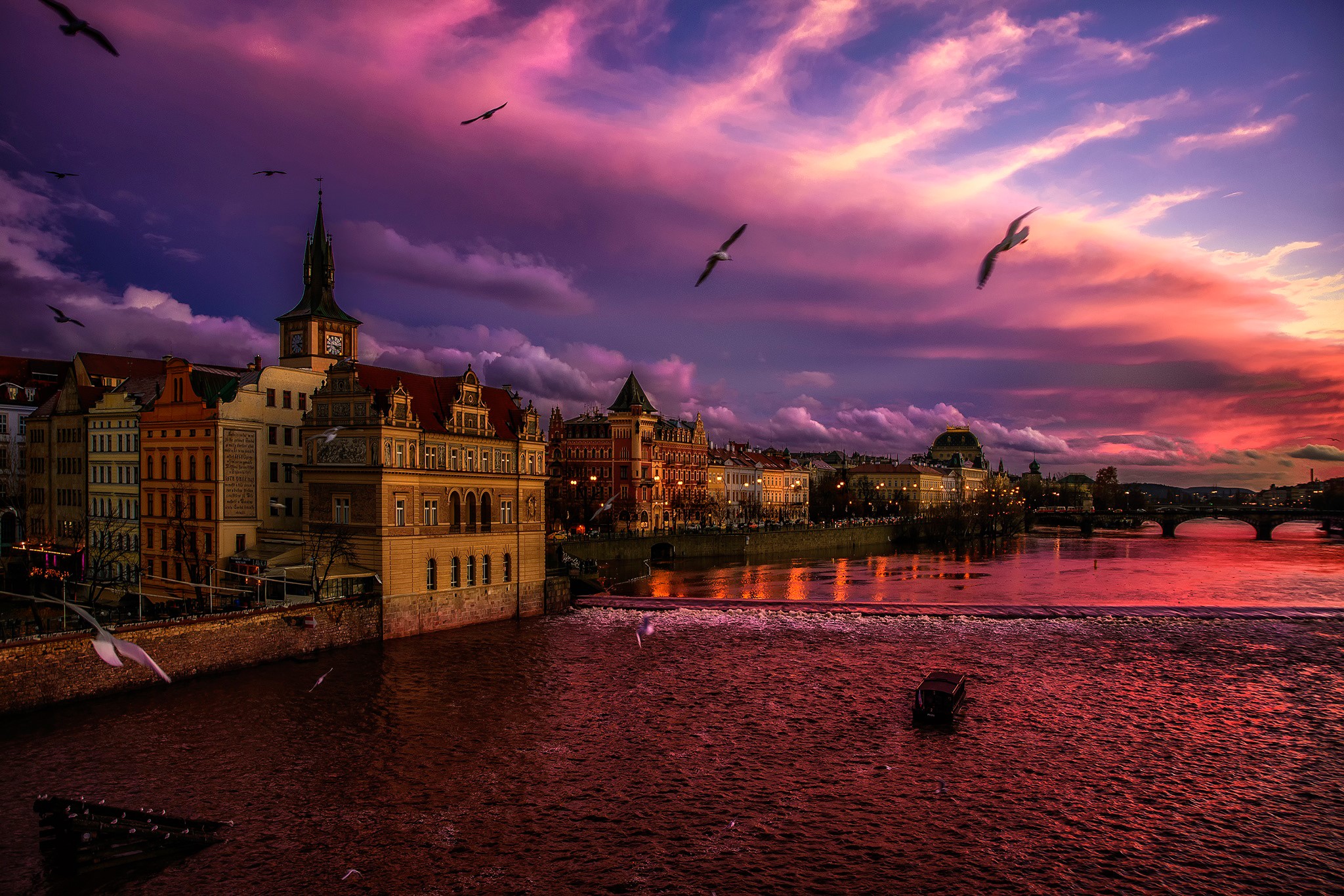 Prague cityscape at sunset with Vltava River and birds HD Wallpaper