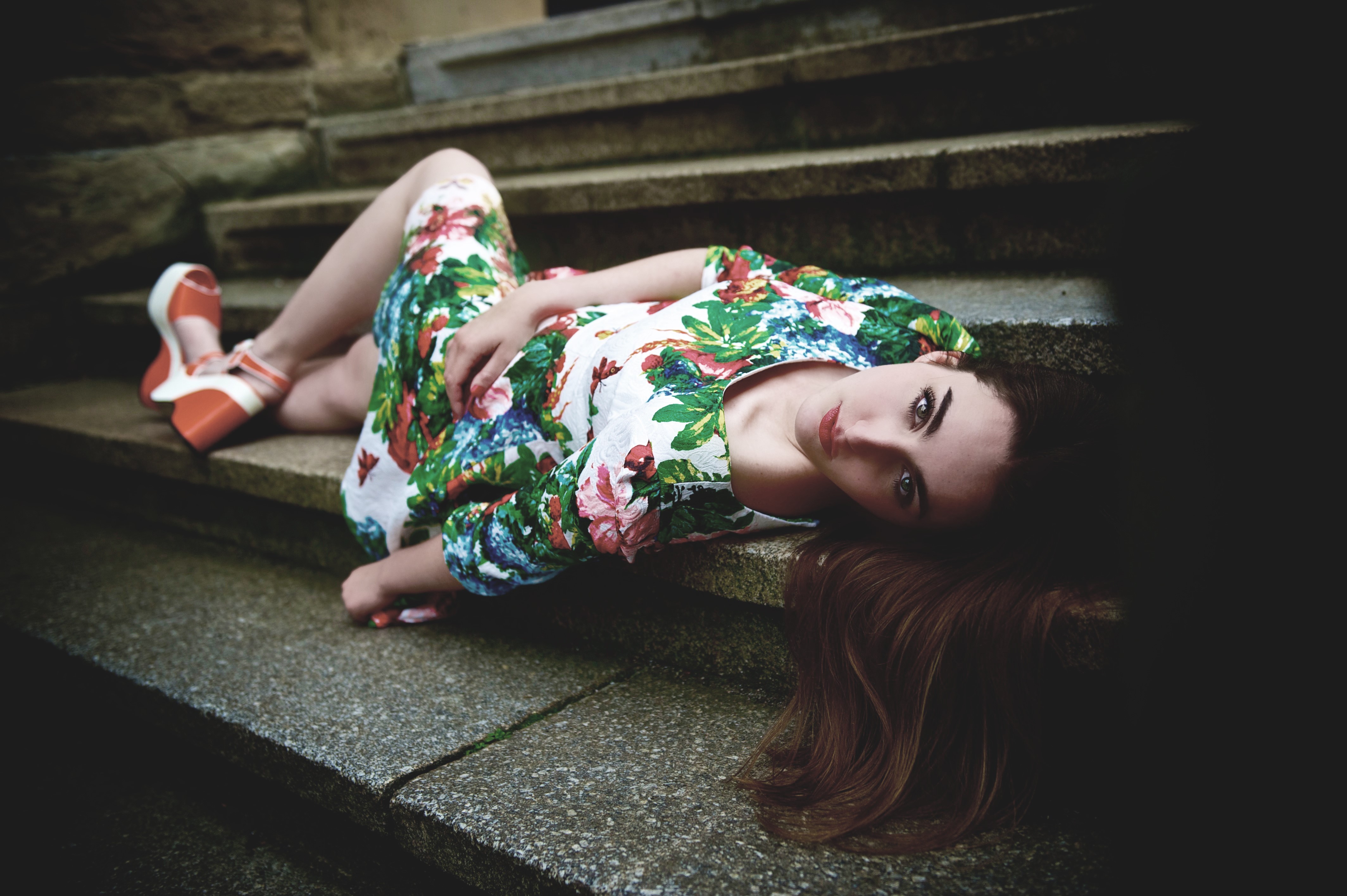 Woman in floral dress lying on stairs HD Wallpaper