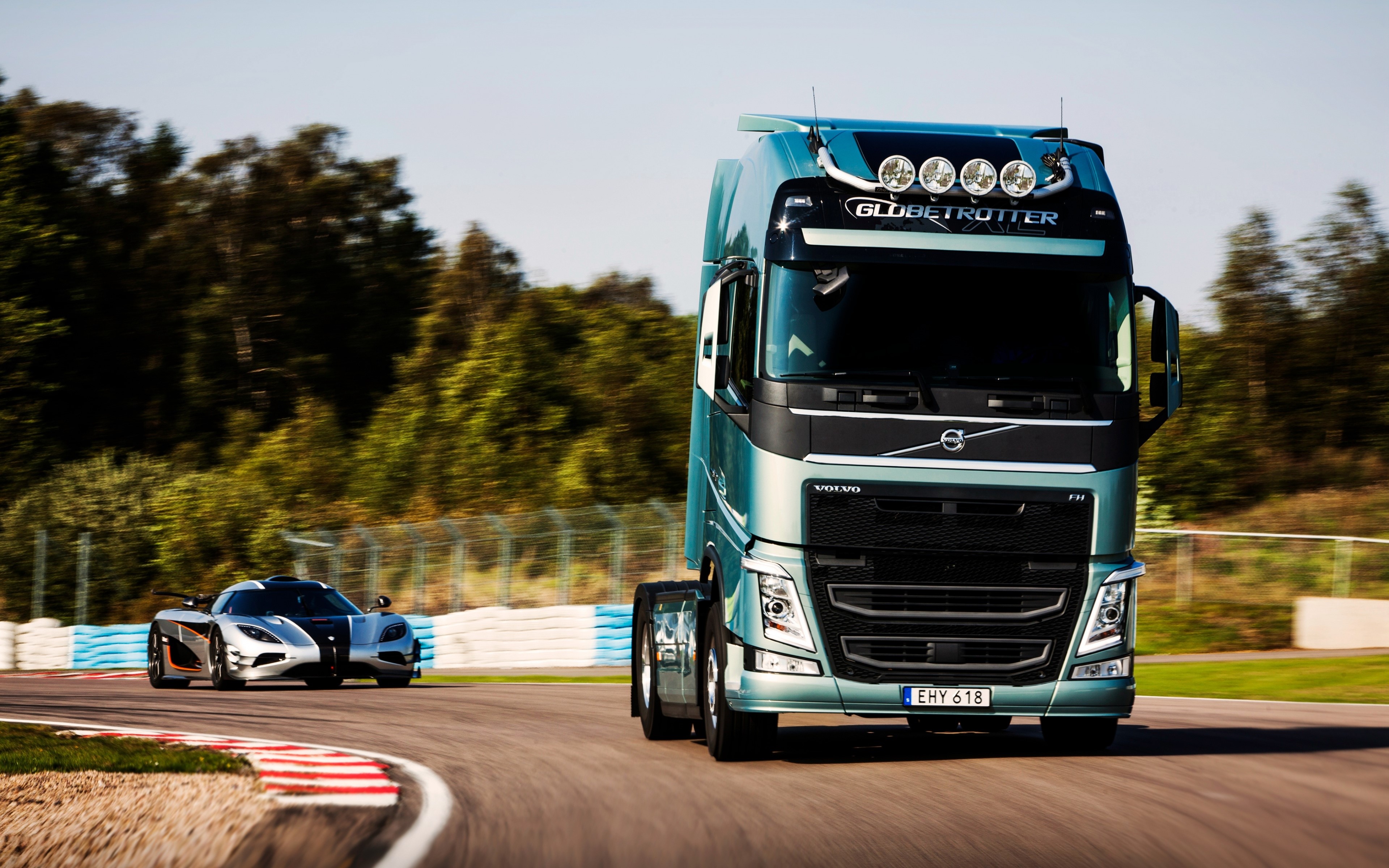 4K Volvo FH and Koenigsegg One:1 on a race track HD Wallpaper