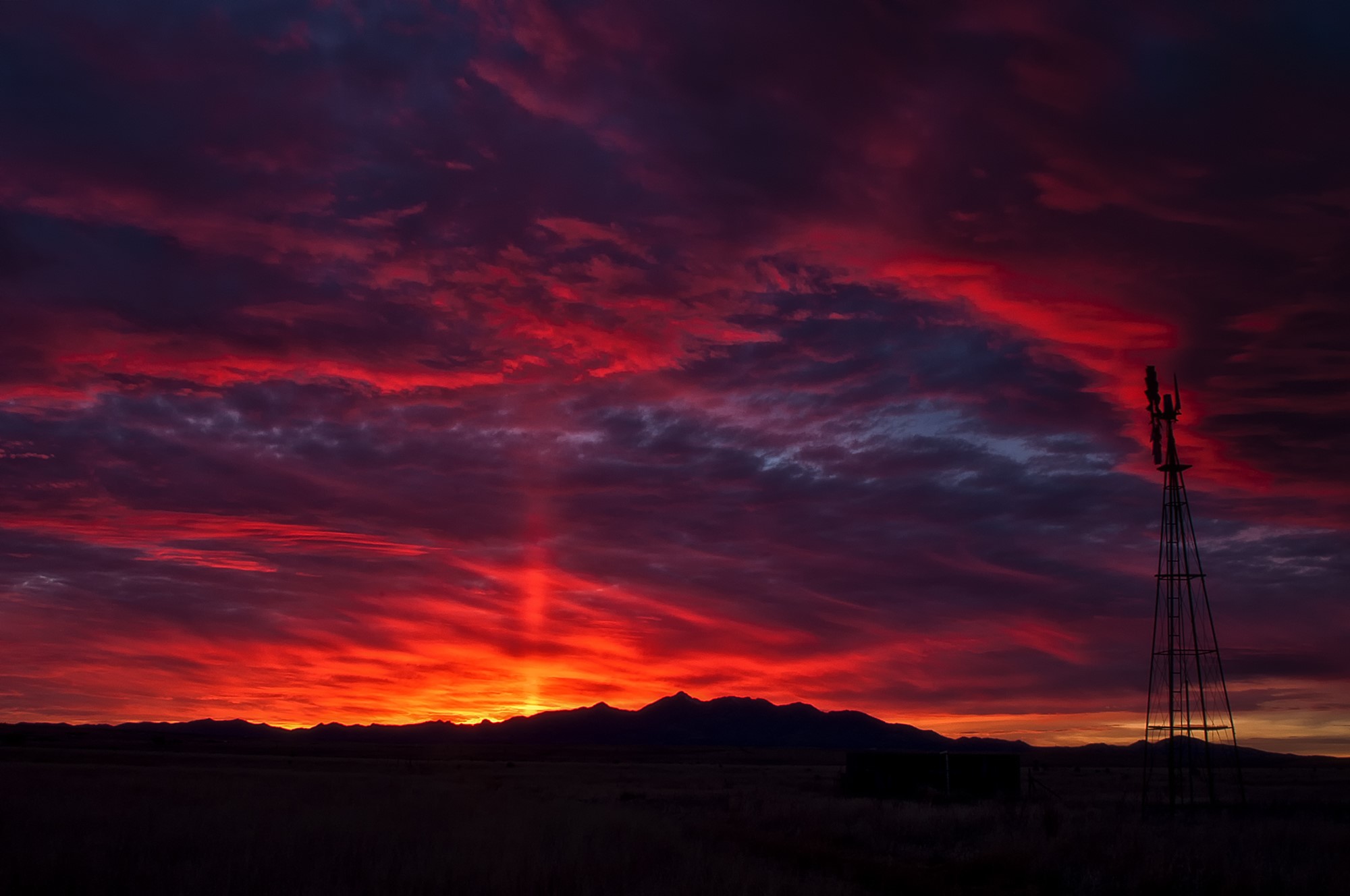 Sunset over mountains with windmill and clouds HD Wallpaper