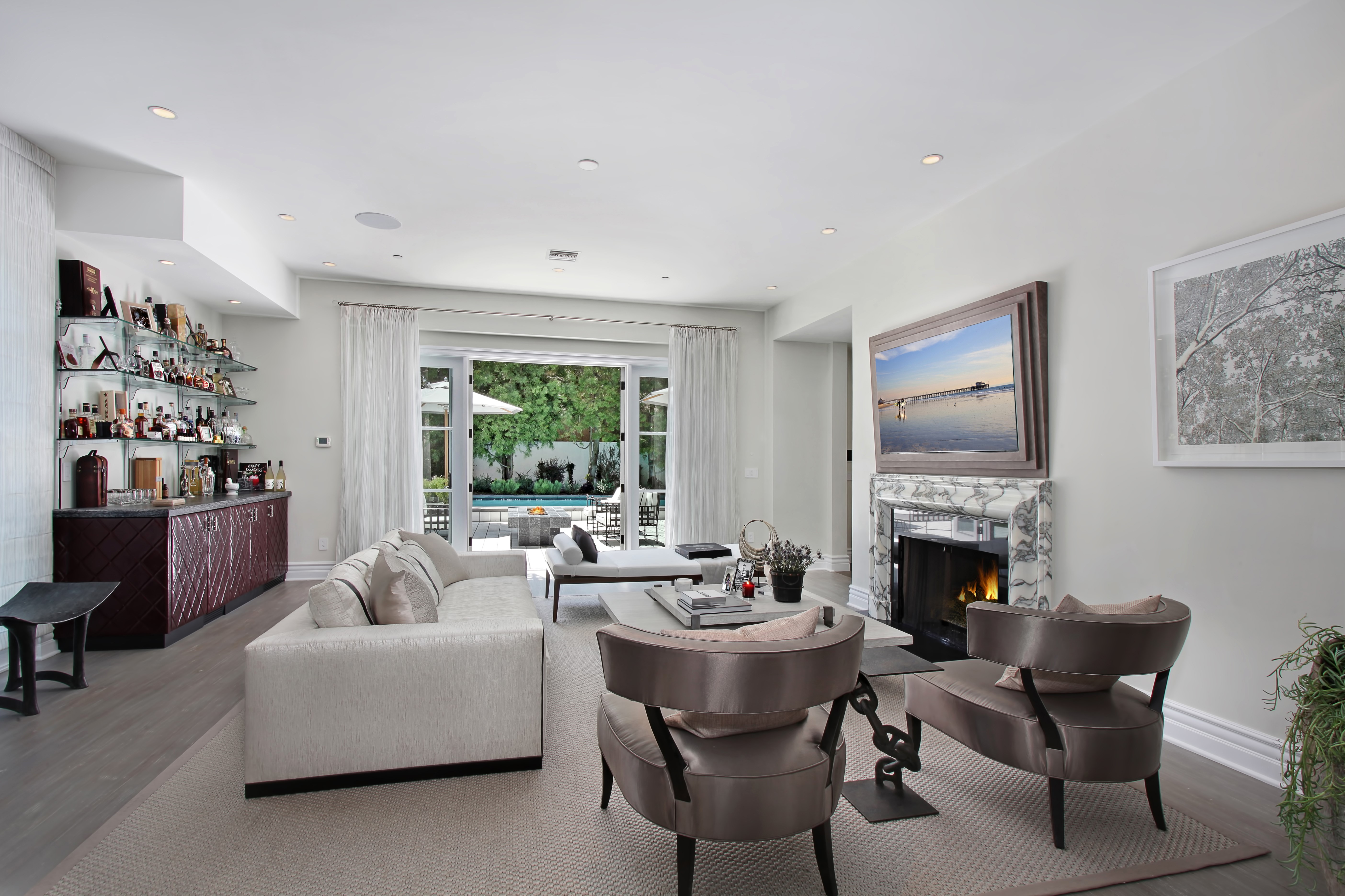 Living room with fireplace, sofa, and bar HD Wallpaper