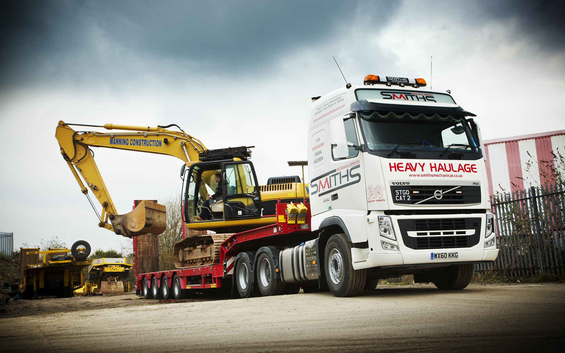 Volvo Heavy Haulage Truck carrying excavator HD Wallpaper