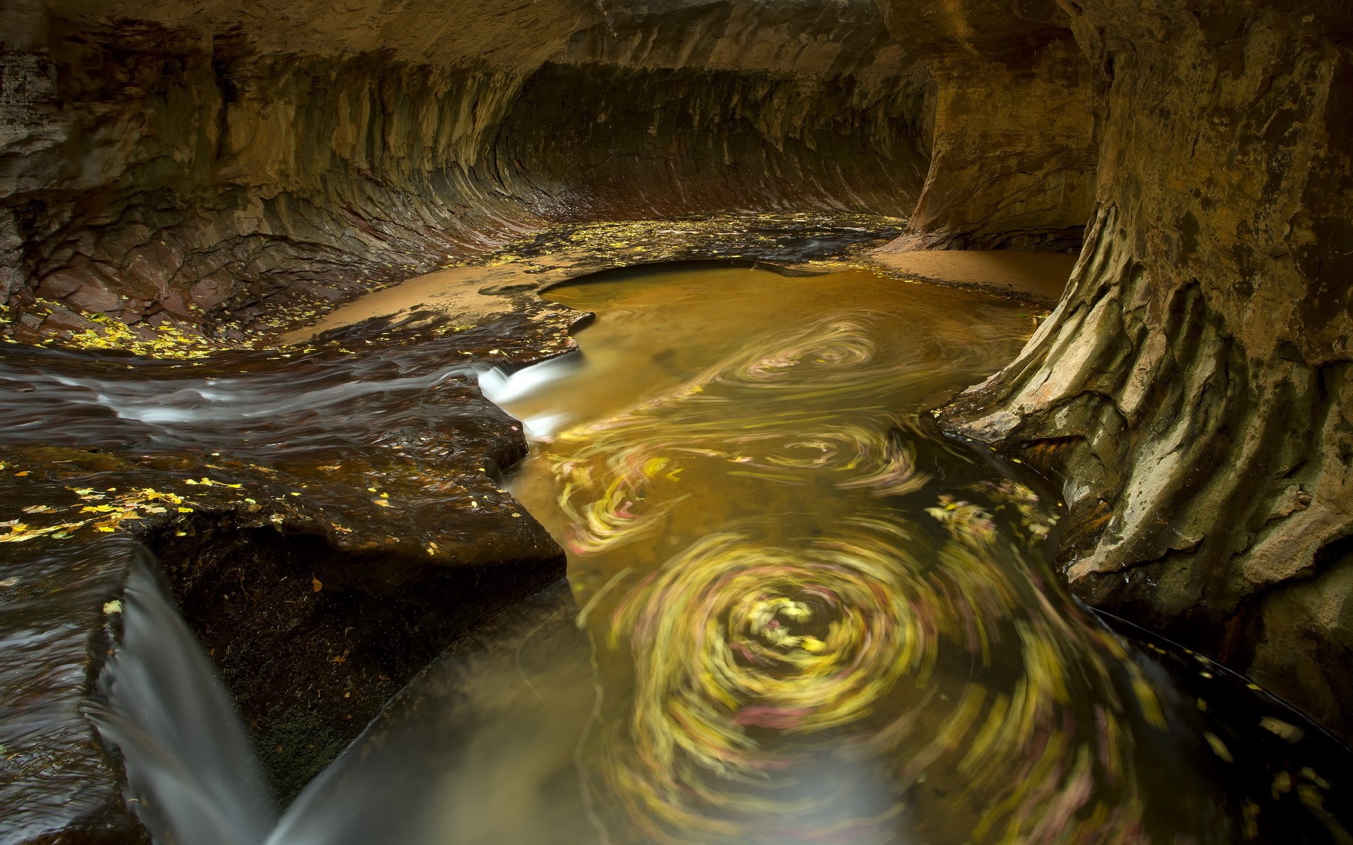 River flowing through a sandstone cave HD Wallpaper