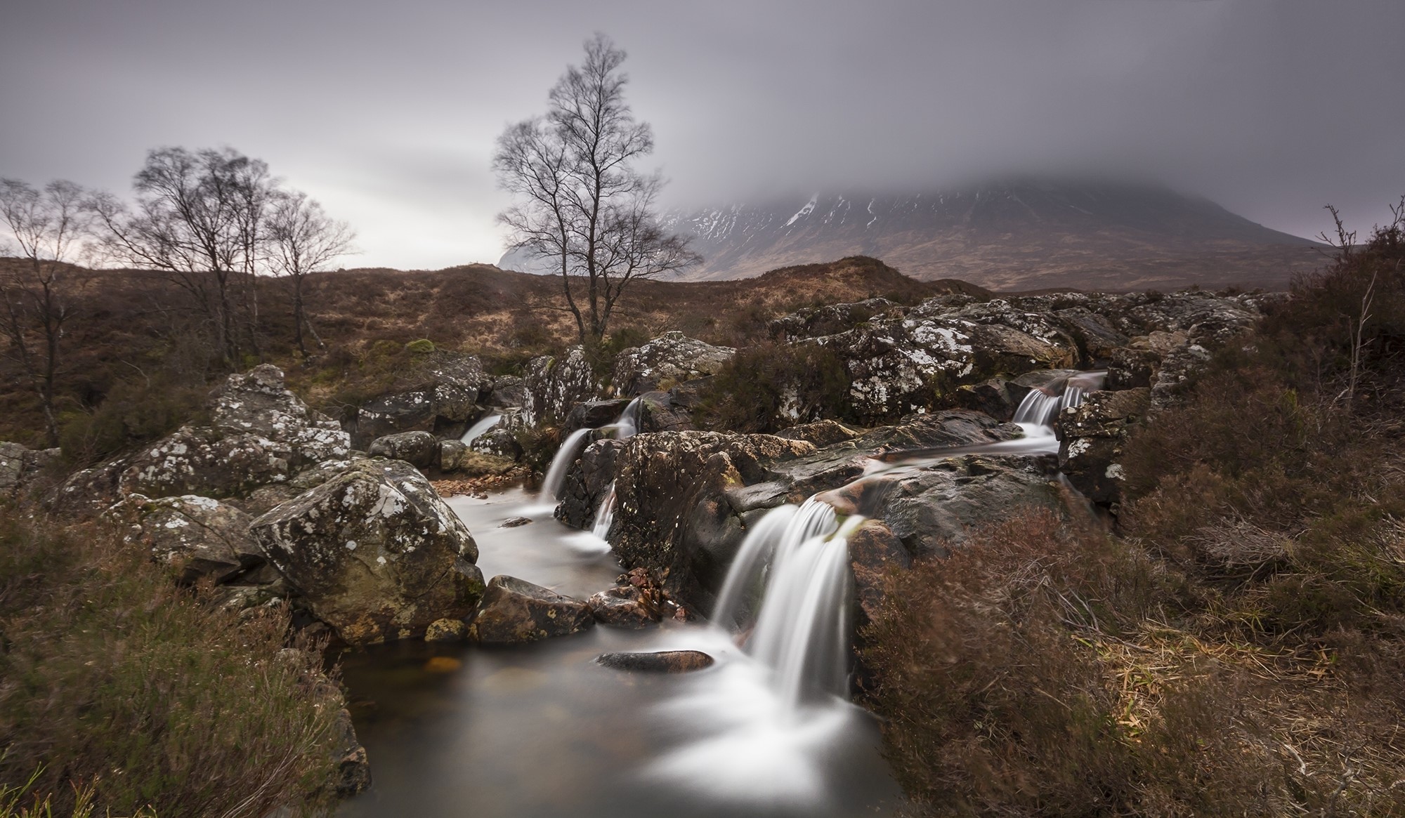 Waterfalls and mountains in a foggy landscape HD Wallpaper