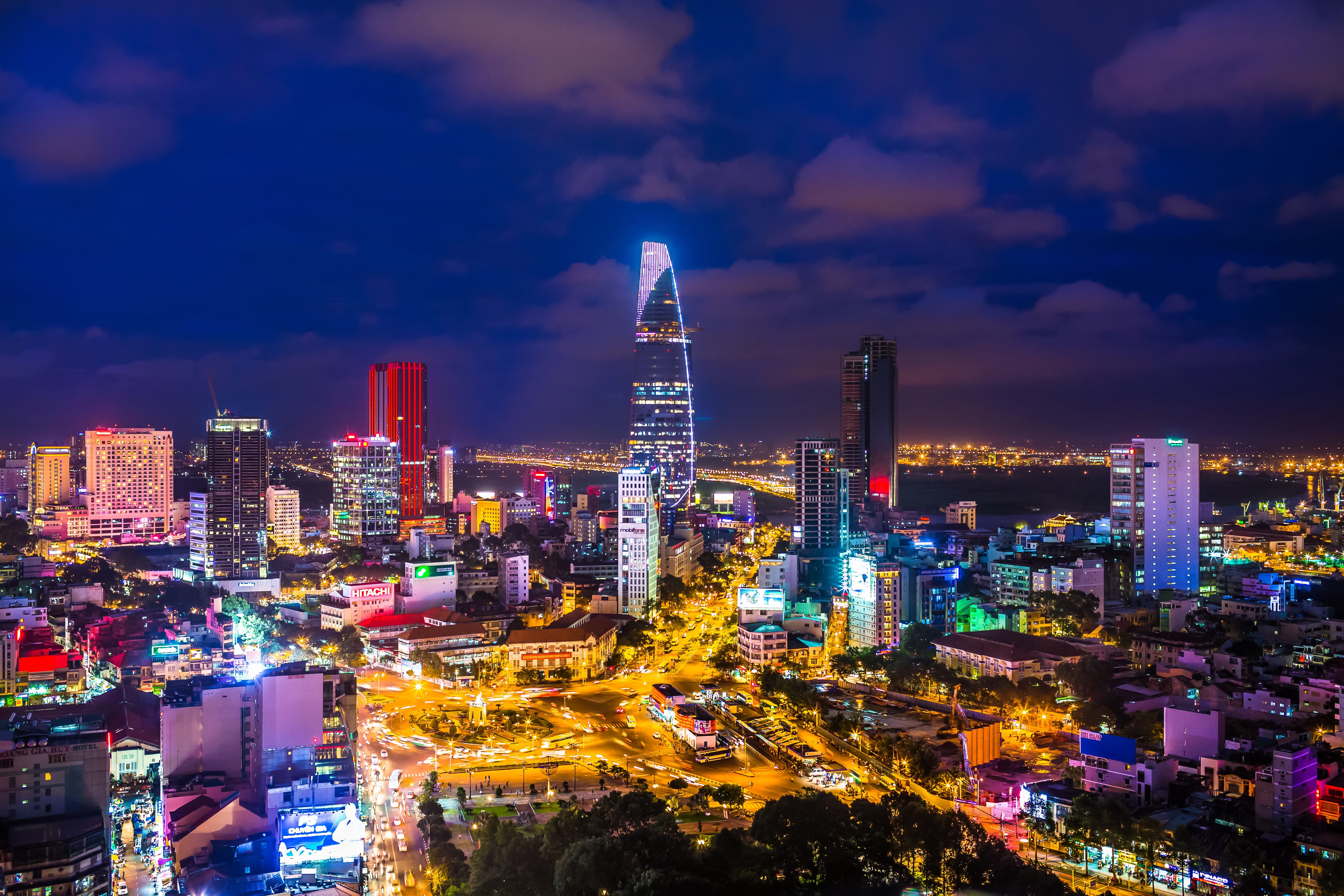 Night view of Ho Chi Minh City skyline with skyscrapers HD Wallpaper
