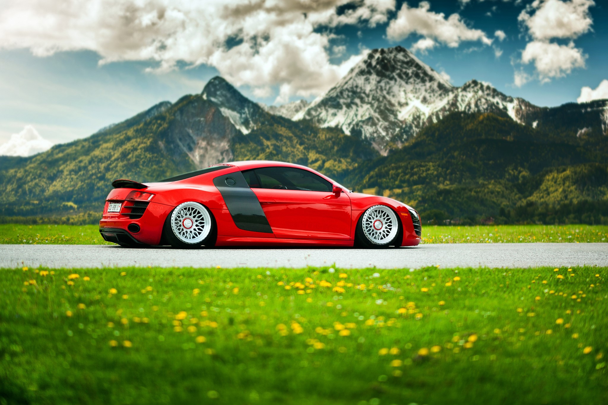 Red Audi R8 parked on a road with mountains HD Wallpaper