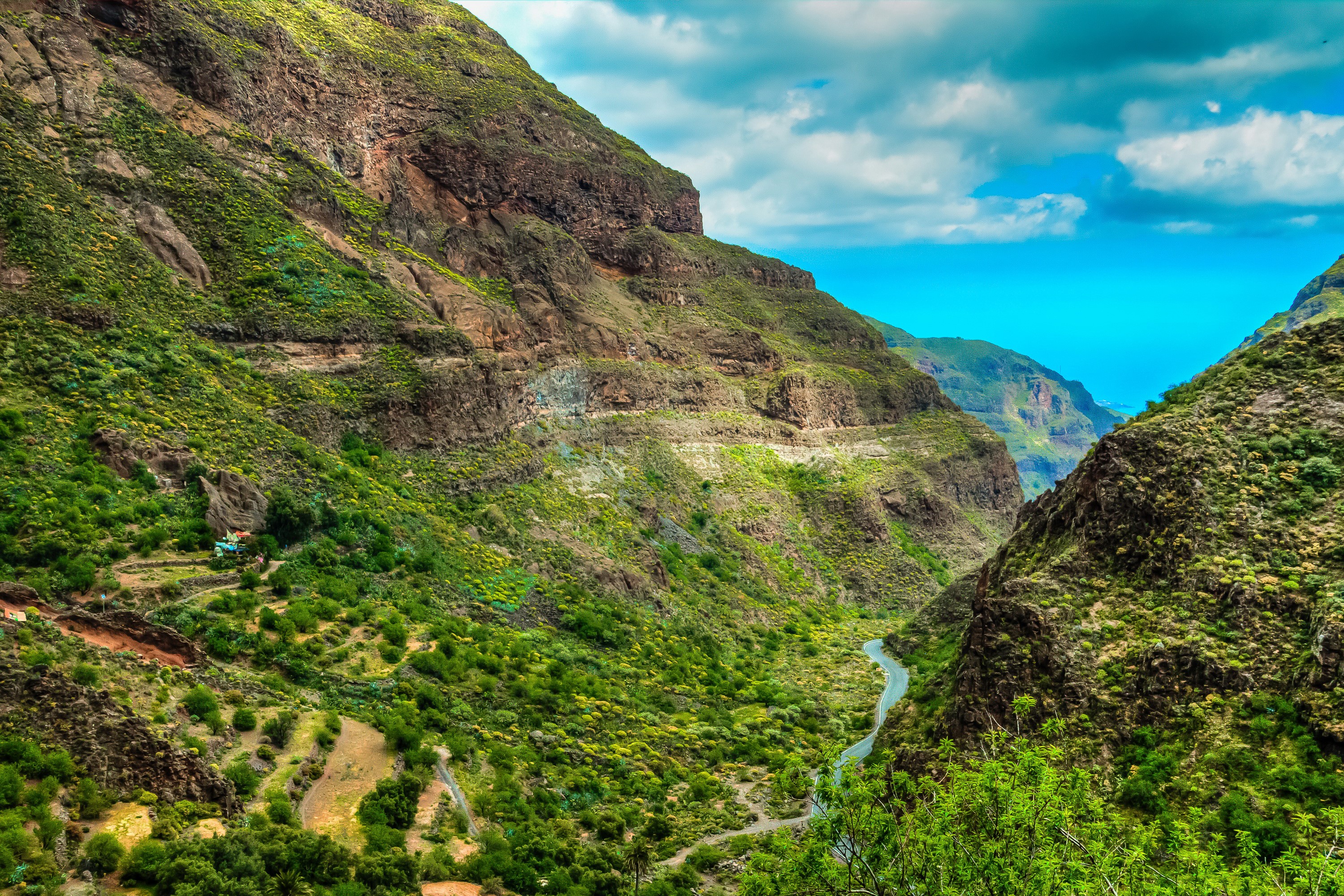 Mountain valley with river and ocean view in Canary Islands, Spain HD Wallpaper