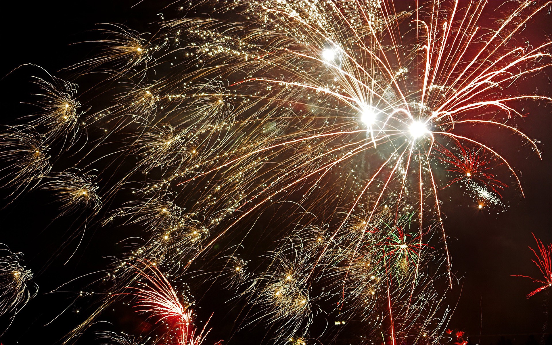 Fireworks exploding in the night sky HD Wallpaper