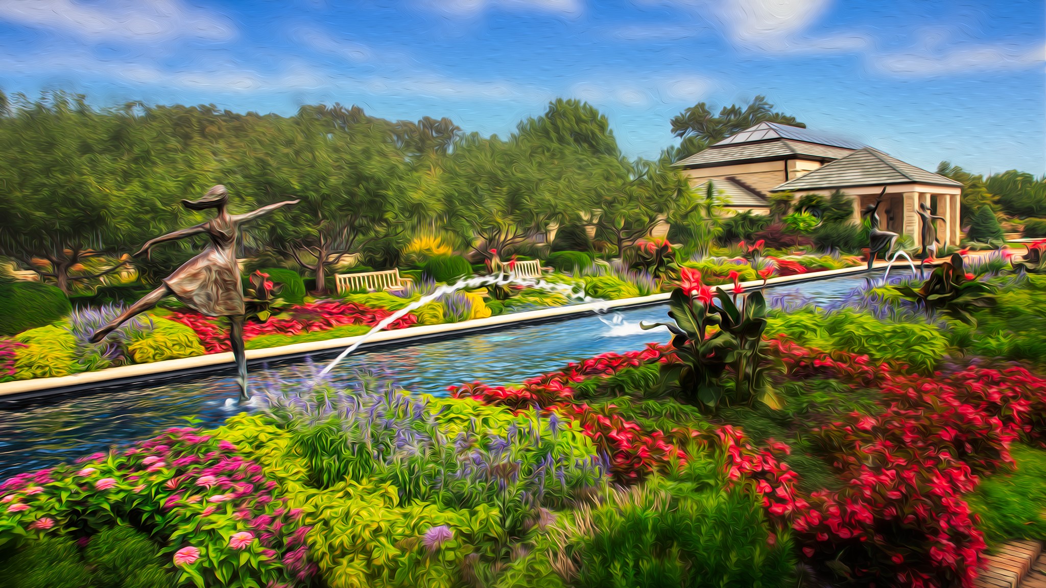 Sculptures and fountains in a vibrant garden with buildings HD Wallpaper