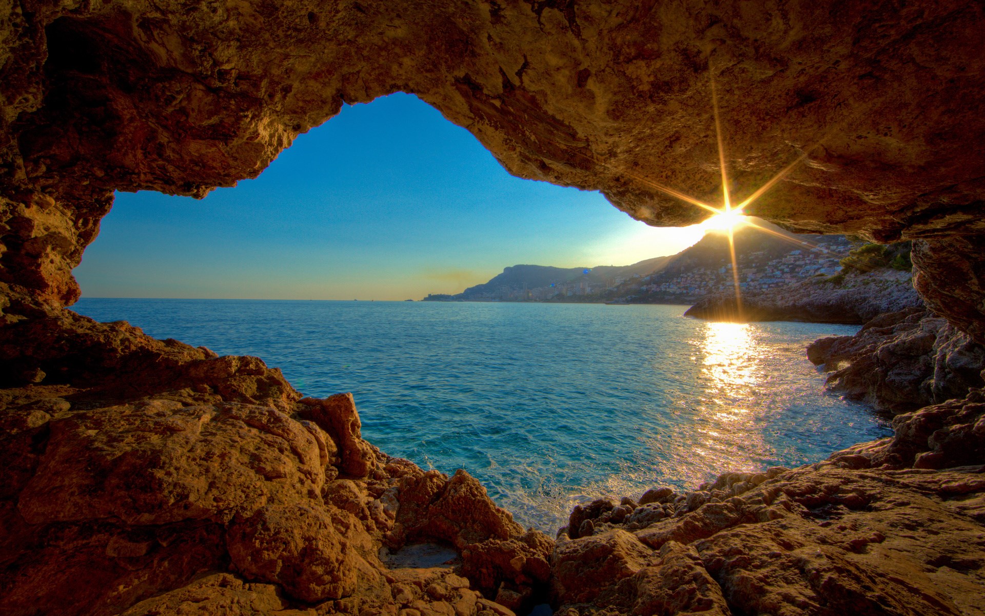 Cave overlooking the sea at sunset HD Wallpaper