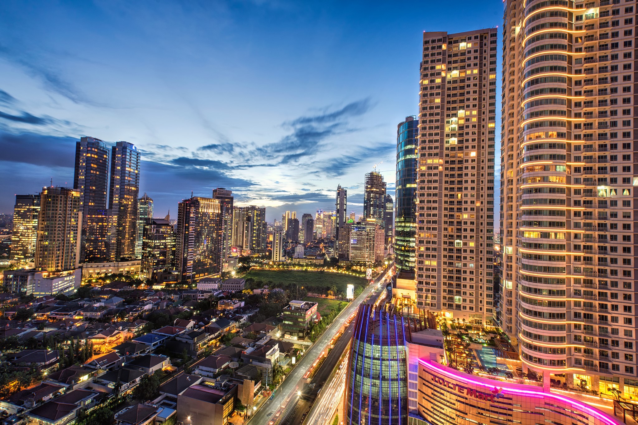 Jakarta Skyscrapers and Houses at Dusk HD Wallpaper