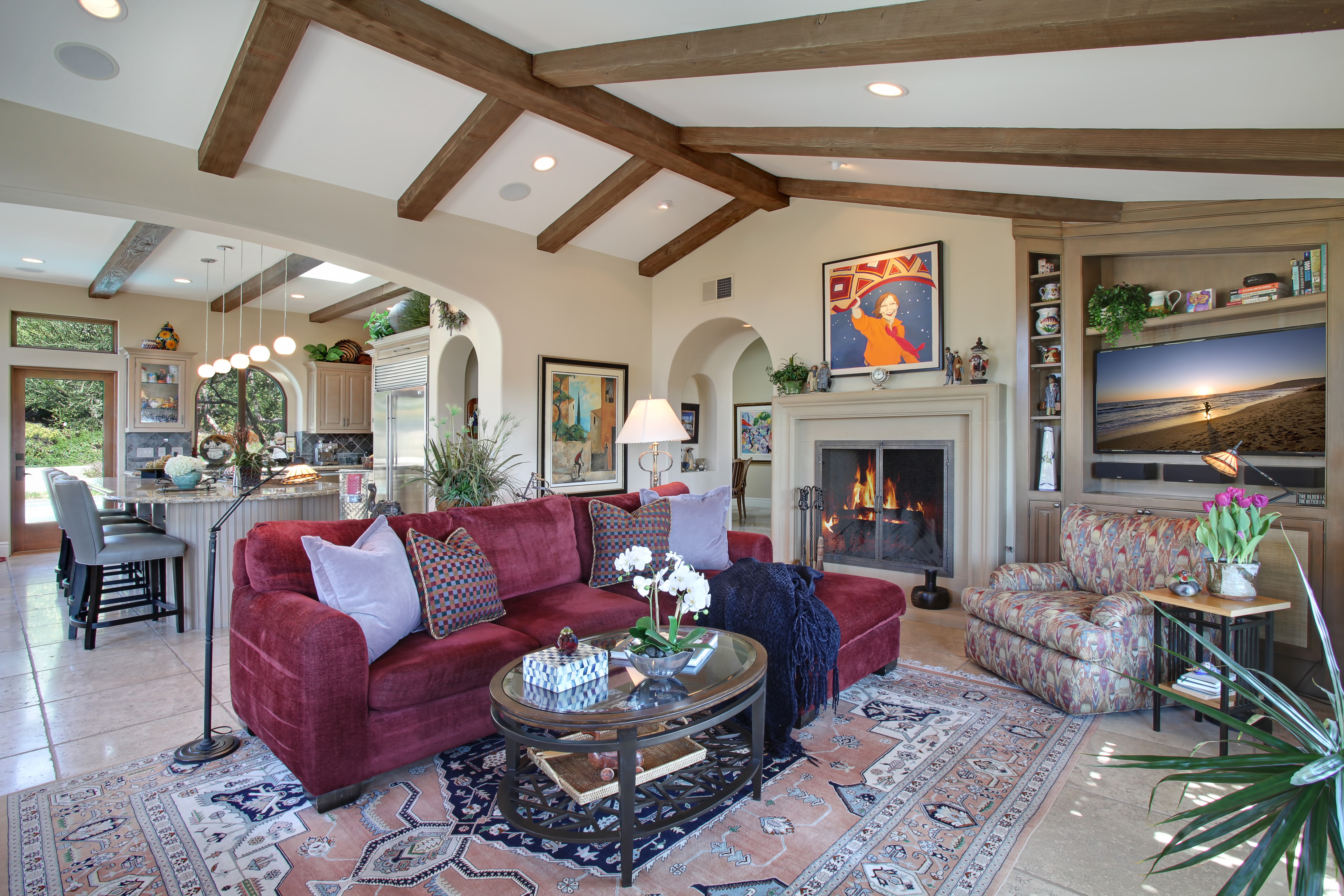 Living room with fireplace, sofa, and armchair HD Wallpaper
