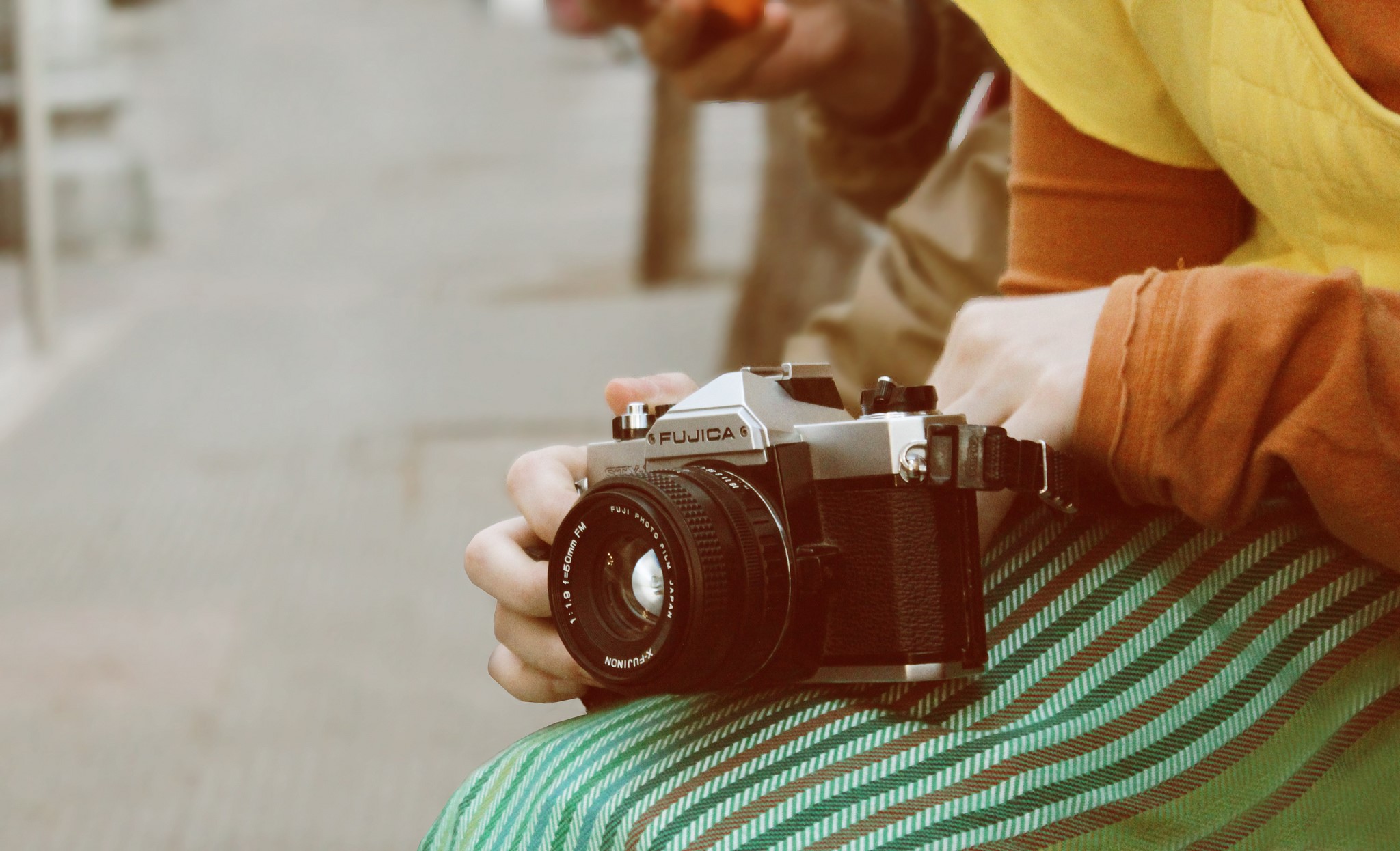 Fujica camera held by a person HD Wallpaper