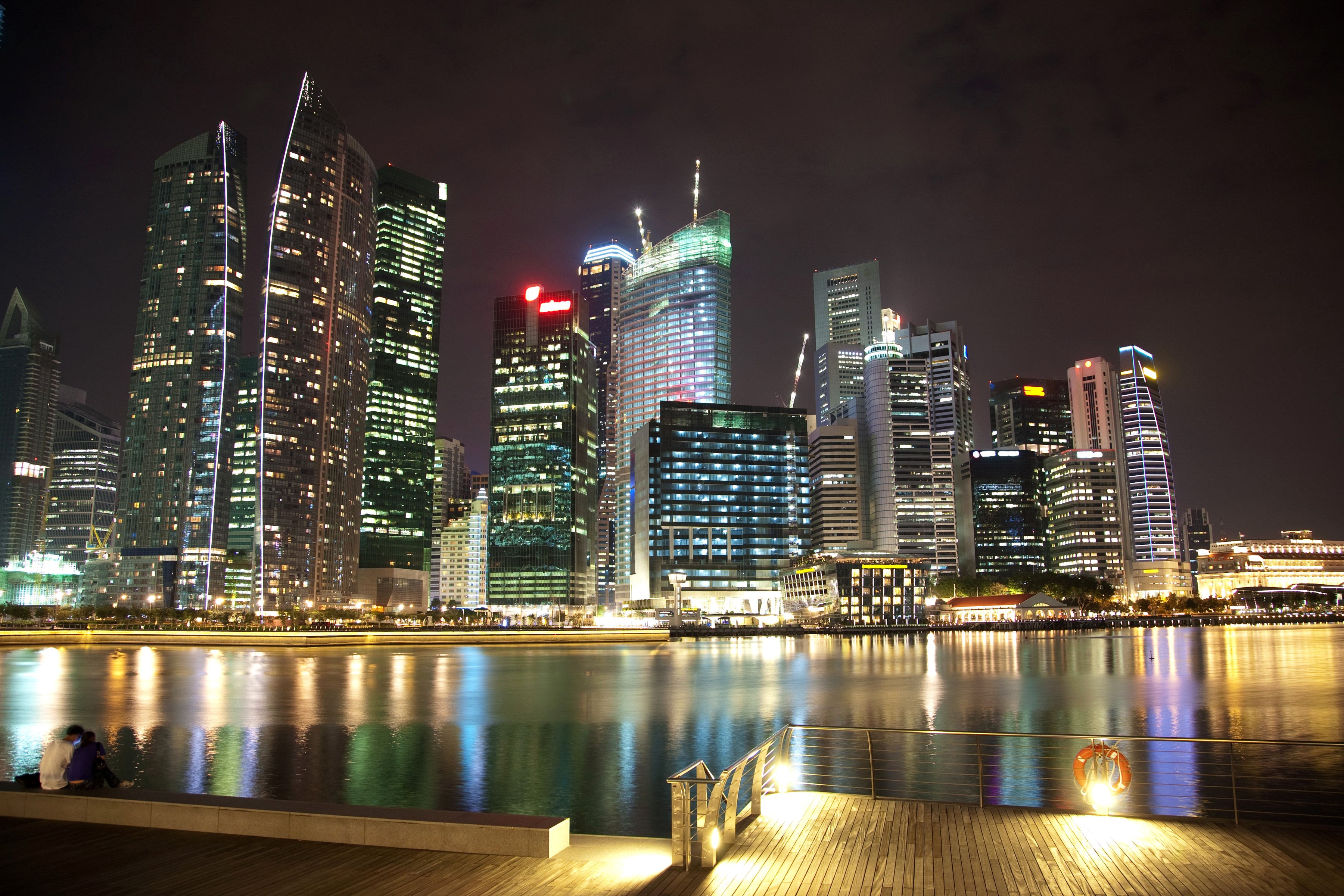 Singapore skyline at night with river and people HD Wallpaper
