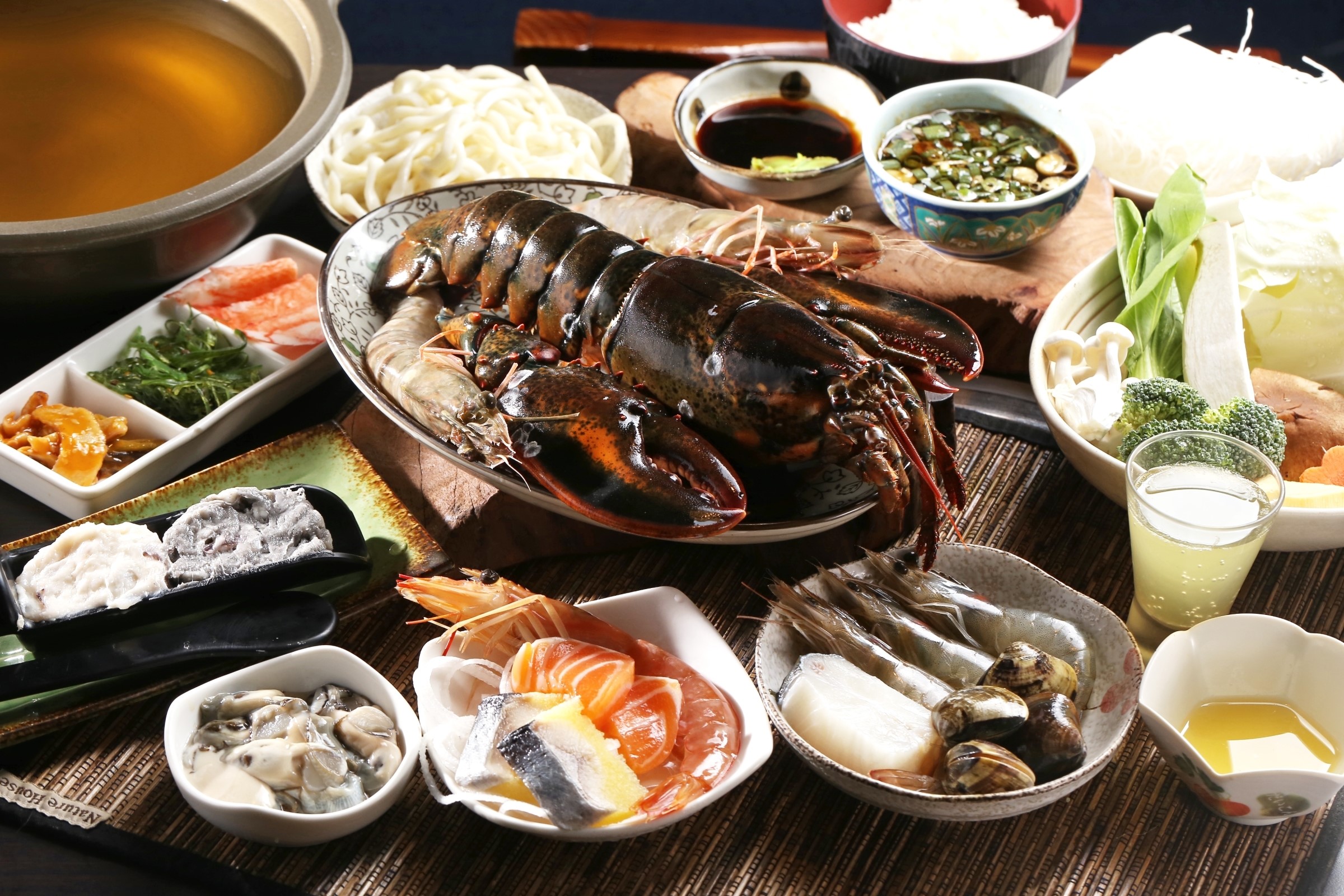 Seafood hot pot with lobster, shrimp, and vegetables HD Wallpaper