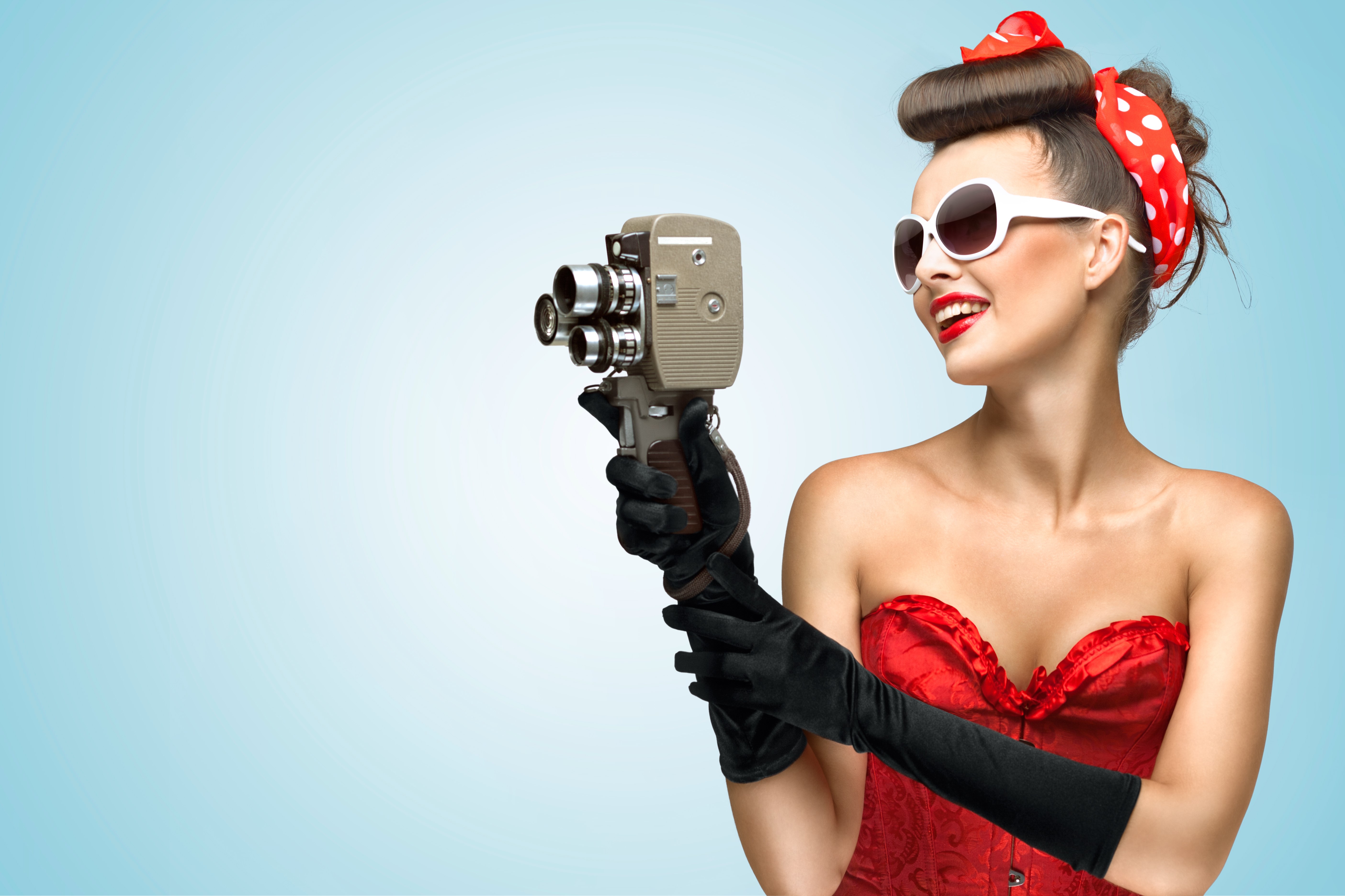 Woman in retro style holding a vintage camera HD Wallpaper