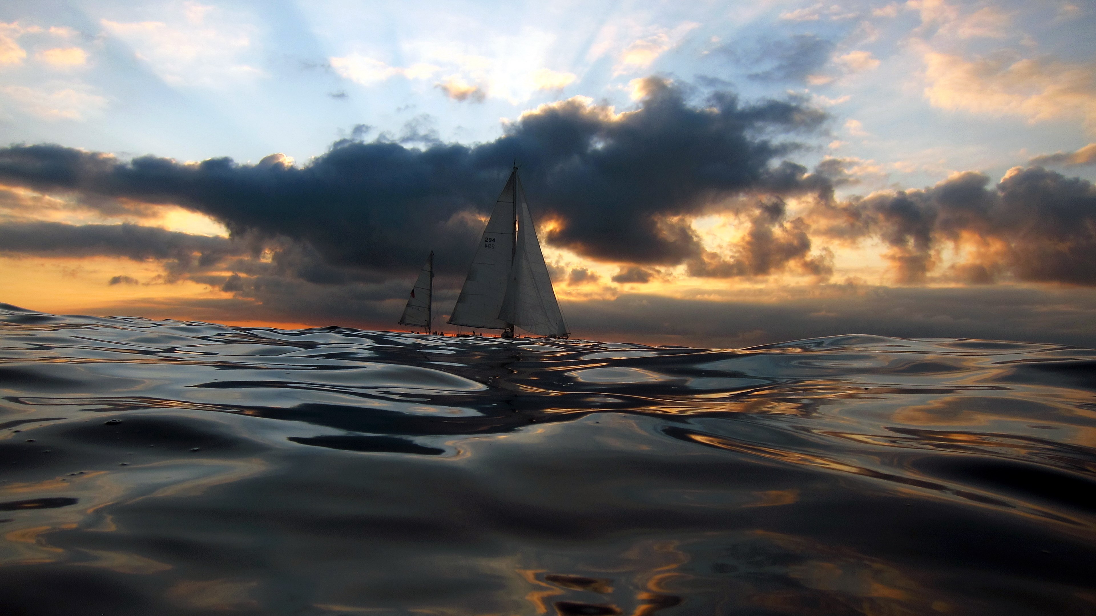 Sailboats on the ocean at sunset HD Wallpaper