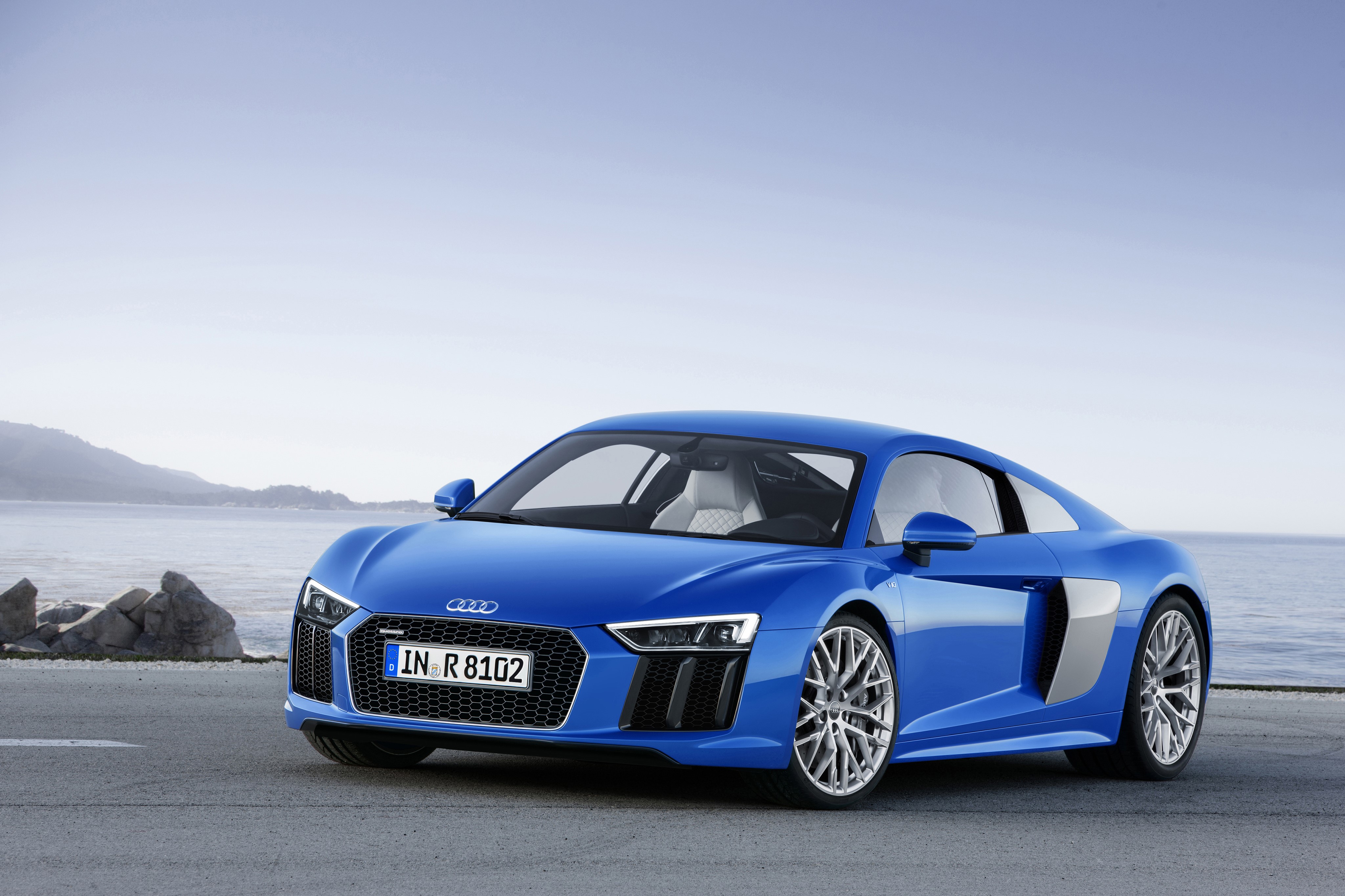 Blue Audi R8 V10 parked by the sea HD Wallpaper