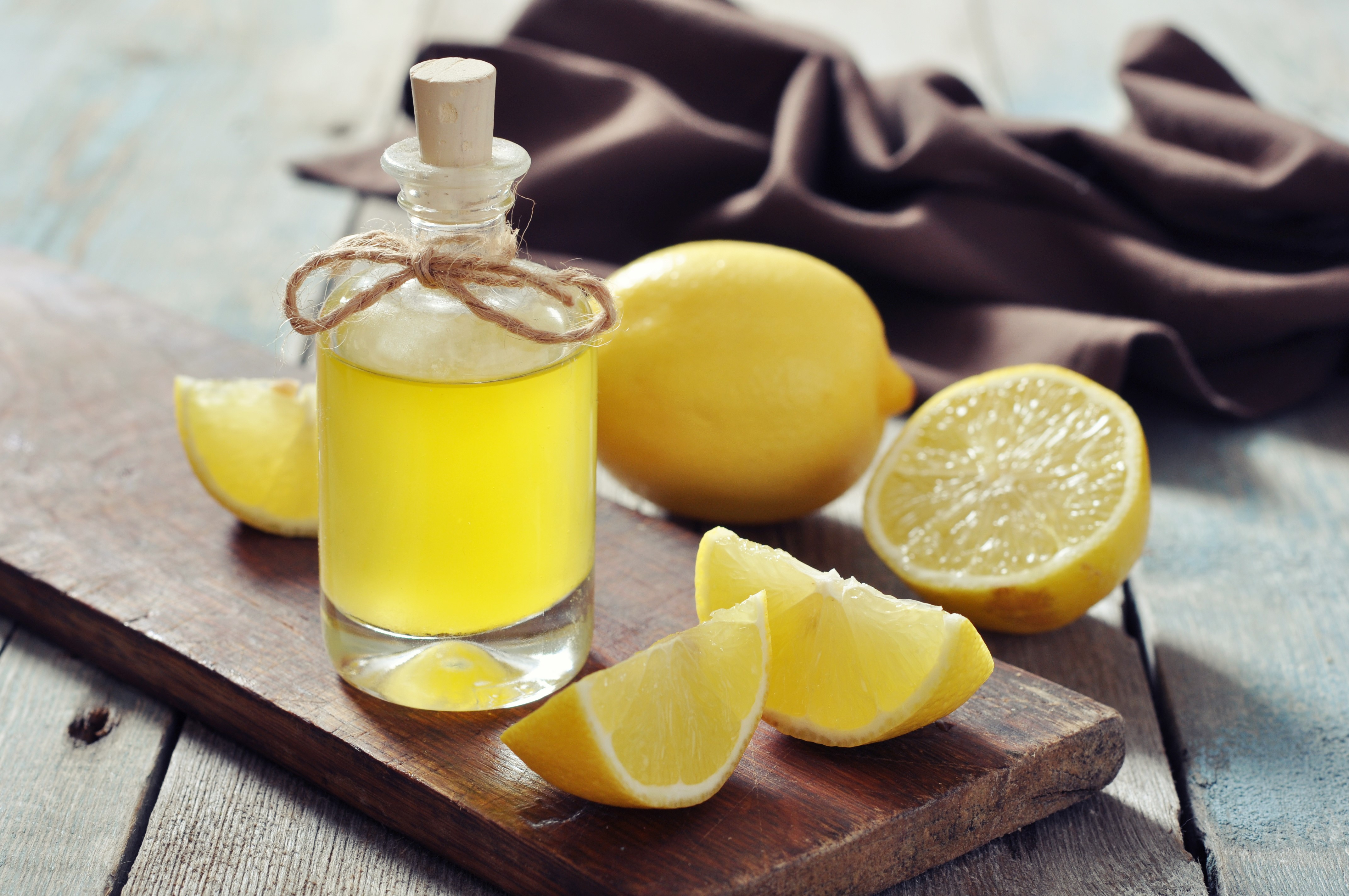 Bottle of Lemon Juice with Lemons HD Wallpaper