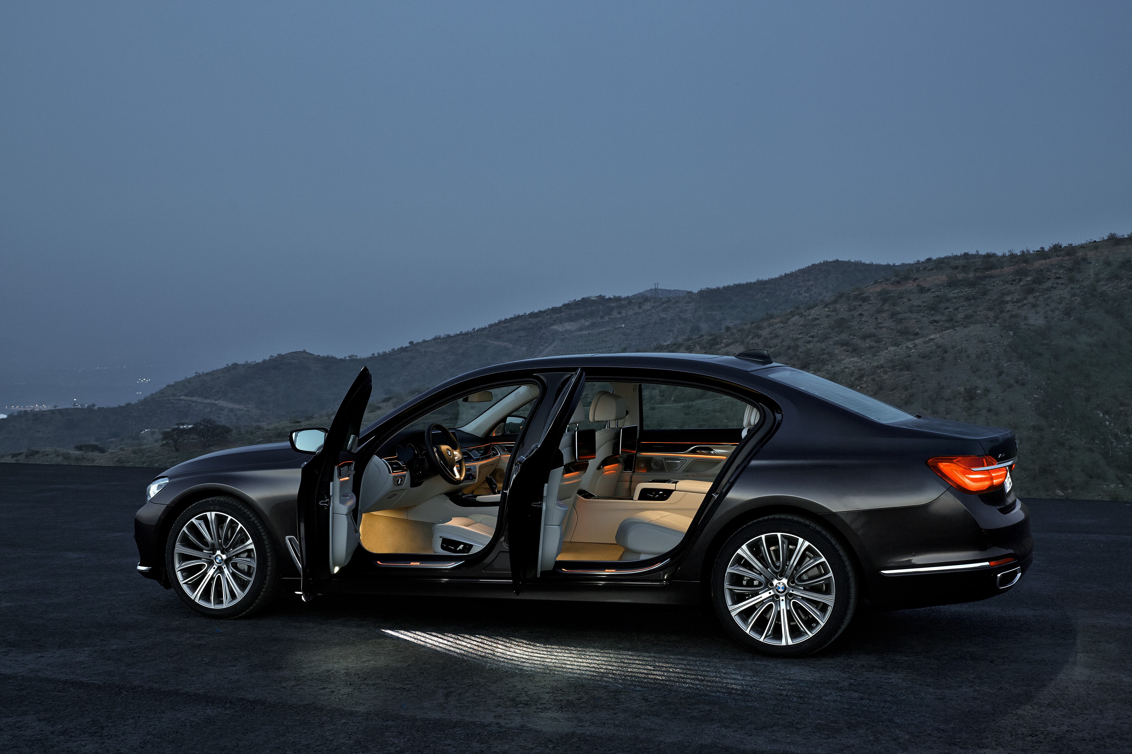 Black BMW 750Li xDrive with doors open HD Wallpaper