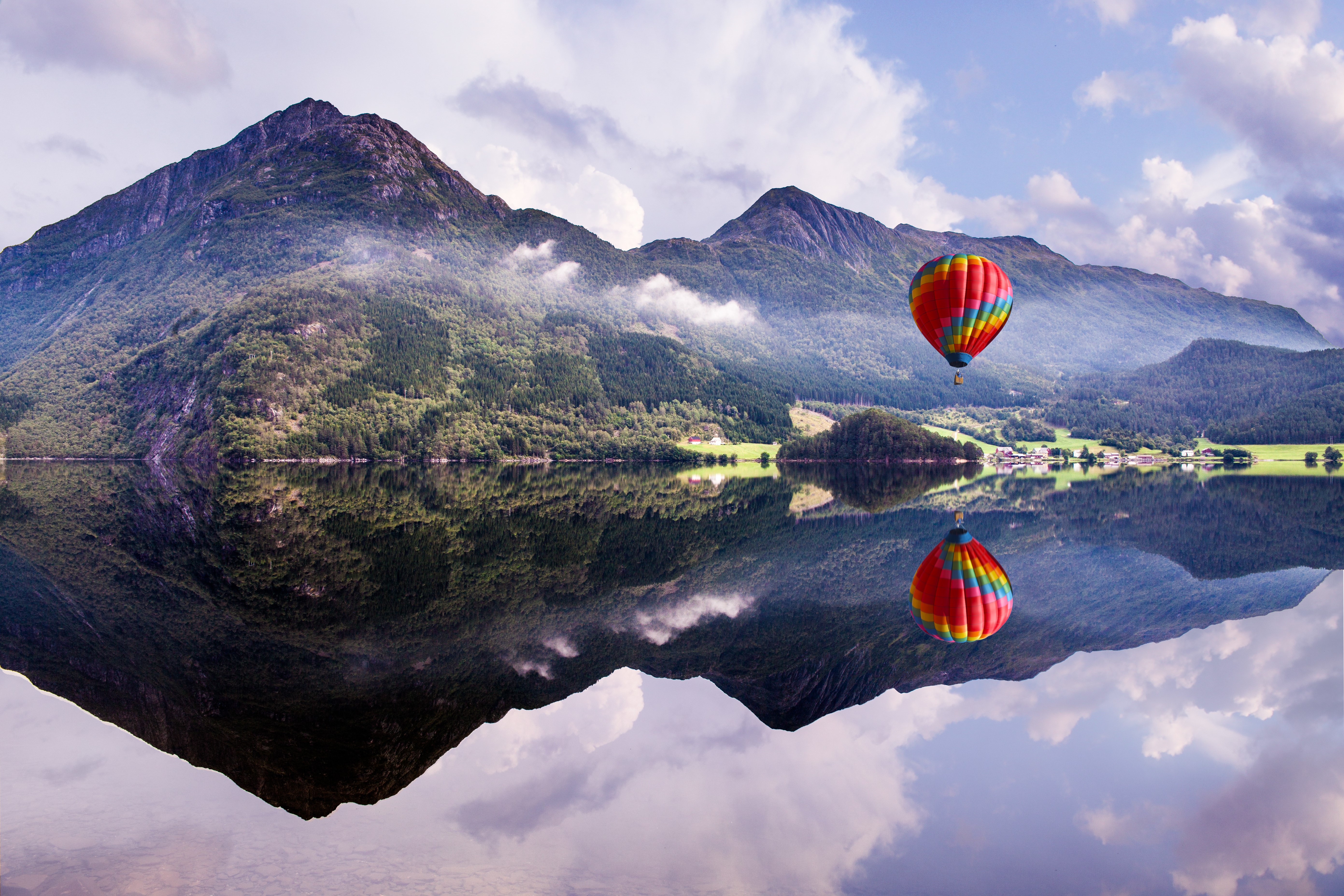 Hot air balloon over mountains and lake reflection HD Wallpaper
