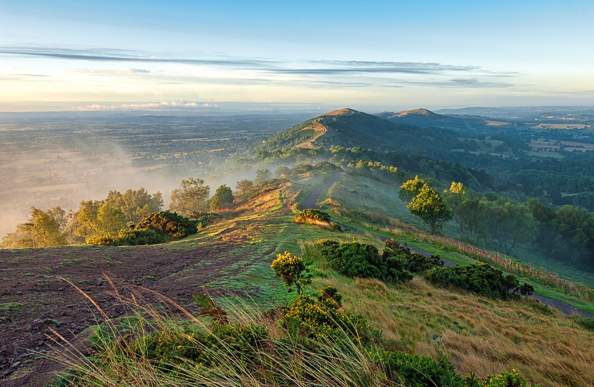 Misty mountain ridge with a trail at sunrise HD Wallpaper