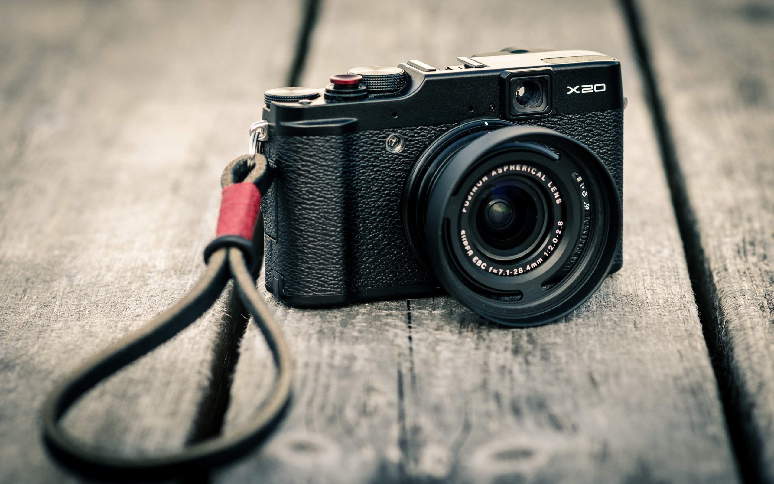 Fujifilm X20 retro camera with strap on wooden surface HD Wallpaper