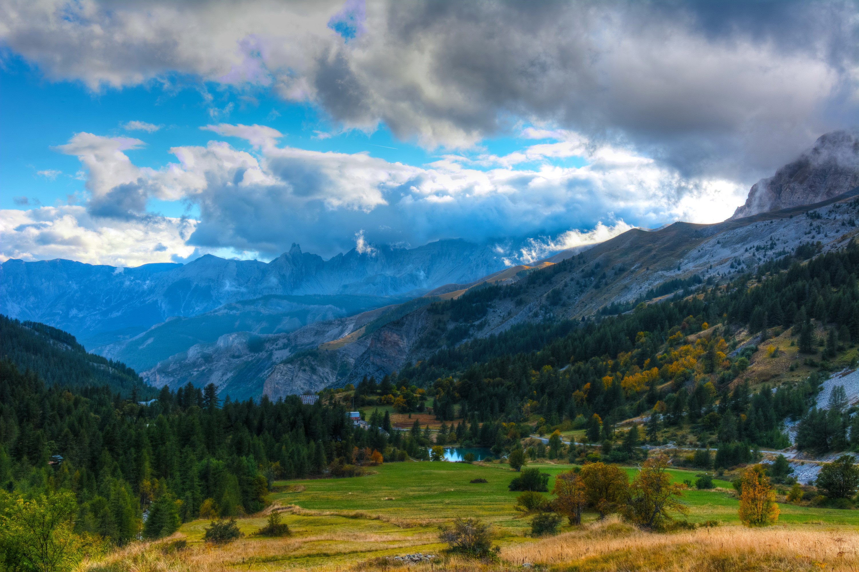 Mountain landscape with trees and clouds in Estenc, France HD Wallpaper