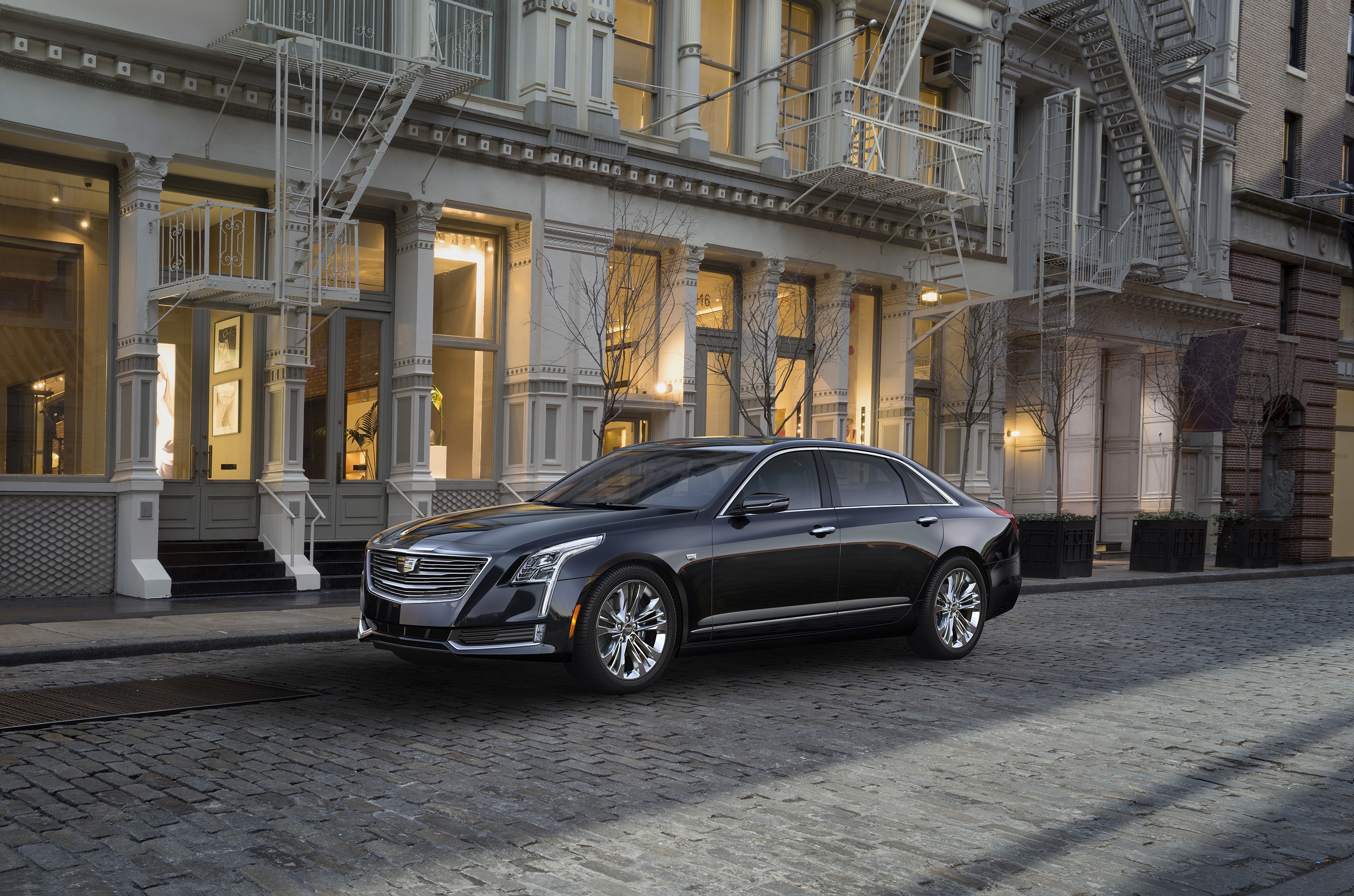 Black Cadillac CT6 Sedan on a Cobblestone Street HD Wallpaper