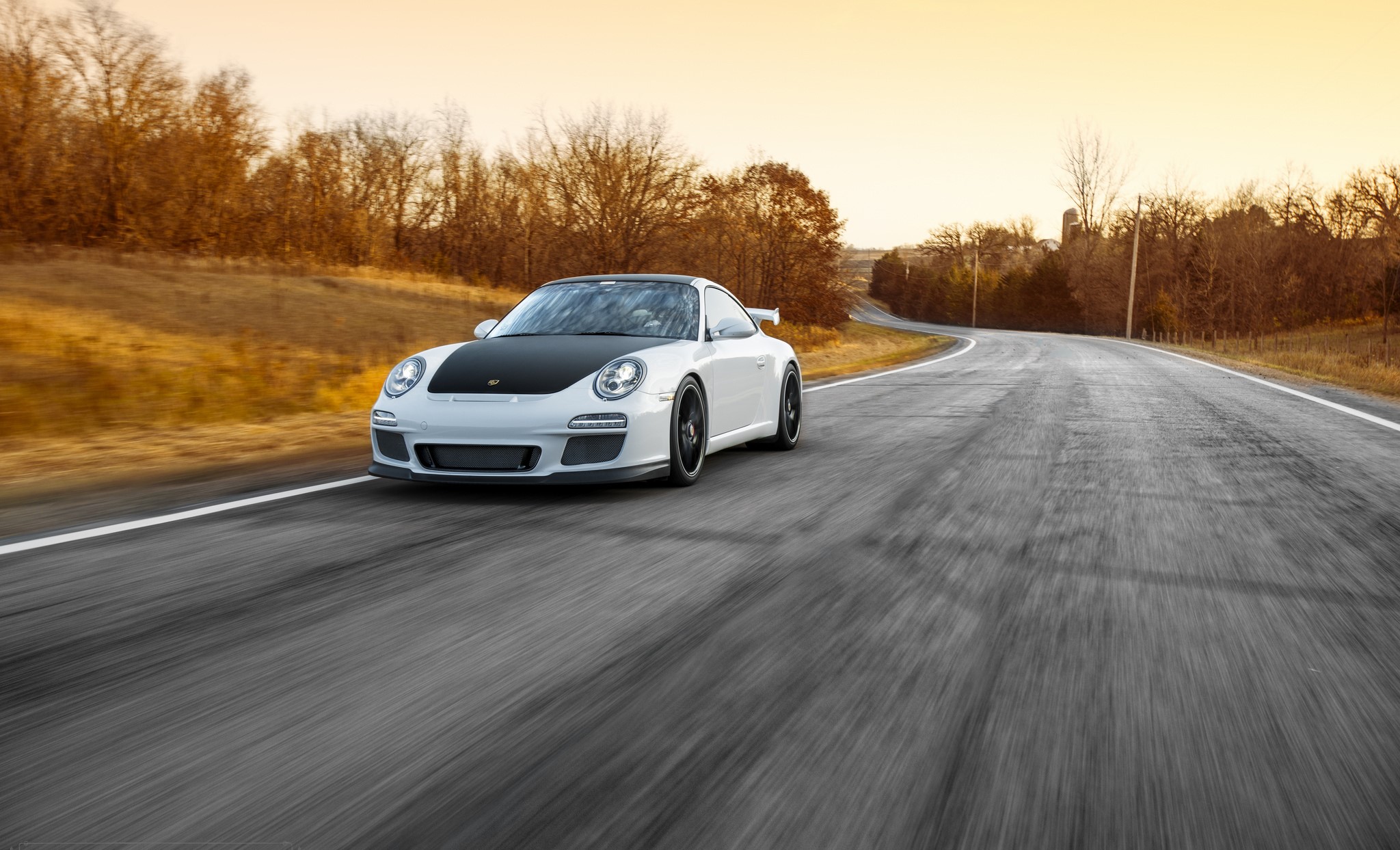 White Porsche 911 driving on a rural road HD Wallpaper