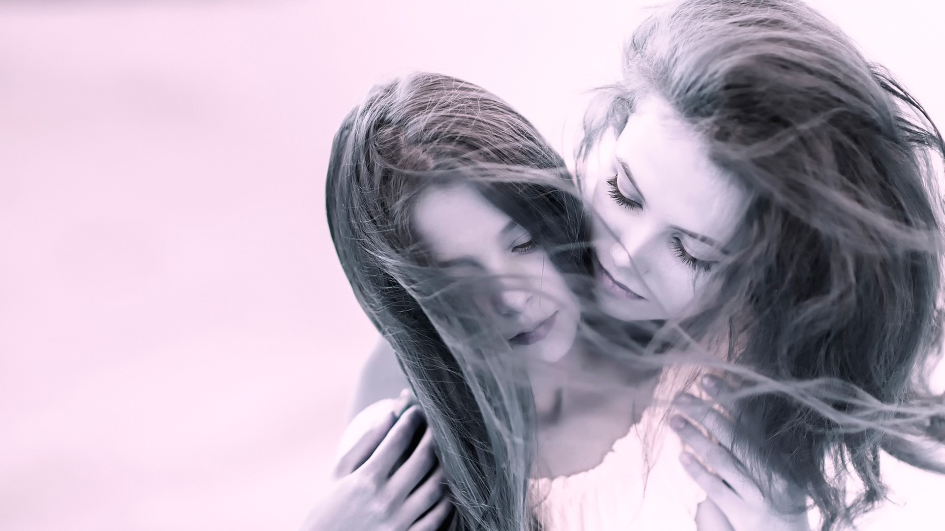 Two young women with windblown hair HD Wallpaper